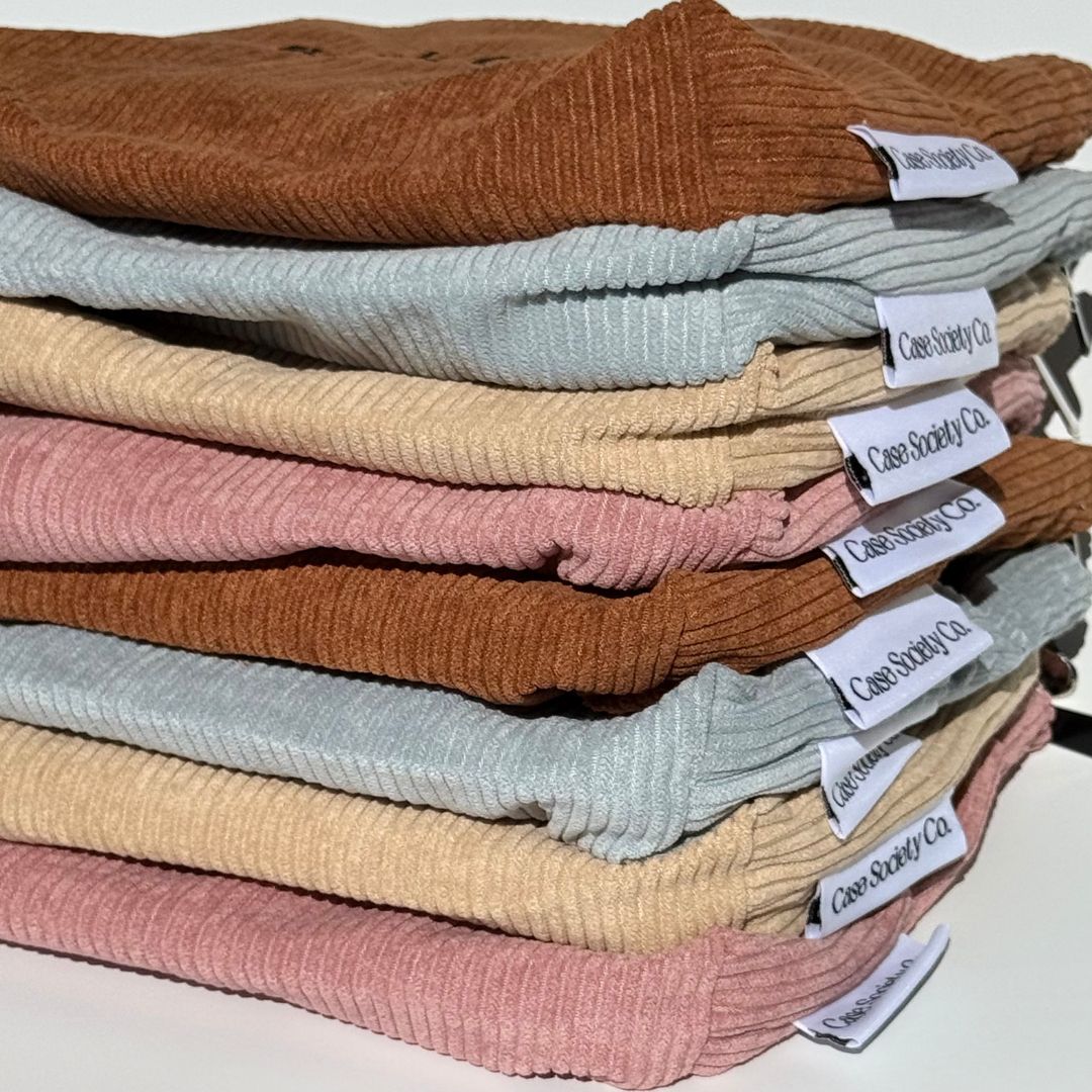 Stack of Book Club e-reader pouches in mocha, powder blue, honey and blush from our Australian shop