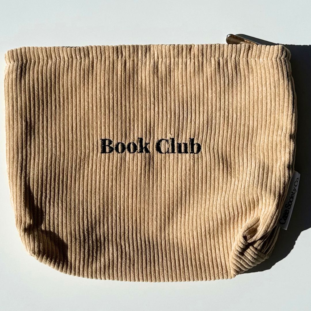 Honey corduroy pouch for Kindle and Kobo angled in sunlight with woven Case Society Co label