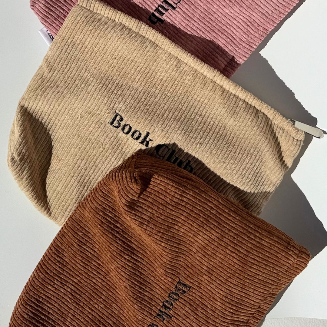 Book Club pouches in blush pink, honey and mocha corduroy fanned together