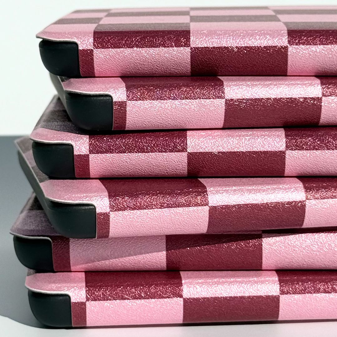 Pink checkered Kindle cases overlapping flatlay — Bordeaux Fiction by Case Society Australia