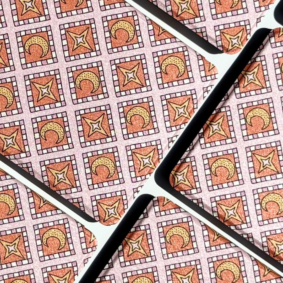 Front and back of the Celestia Kindle case showing the pink celestial mosaic print