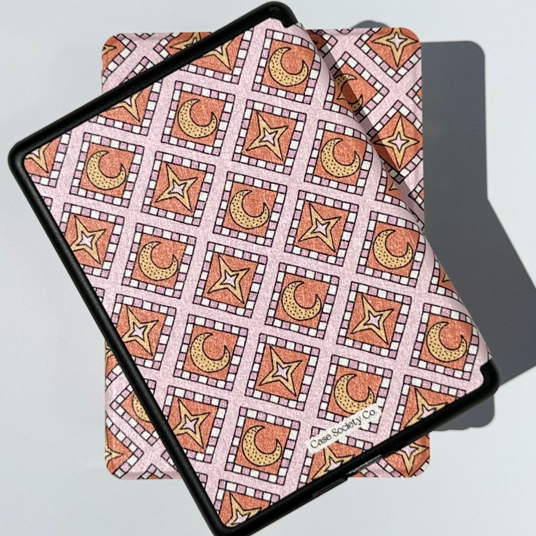 Pink Celestia Kindle cases stacked, showing the moon and star mosaic design