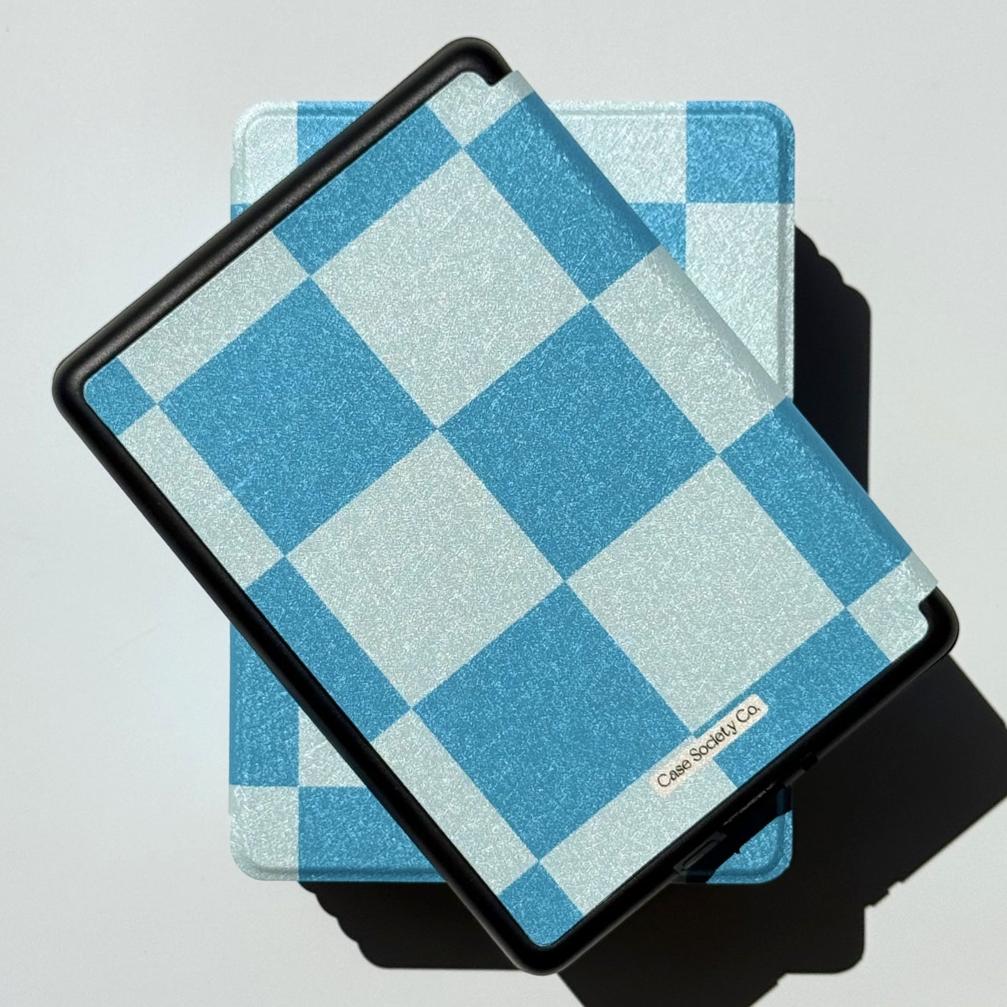 Tonal blue gingham check Kindle case in the Cerulean Lore design, front view