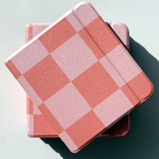 Three Fairy Tales Kobo Libra cases overlapping in coral and pink large-square checkerboard print — coquette cottagecore ereader cover