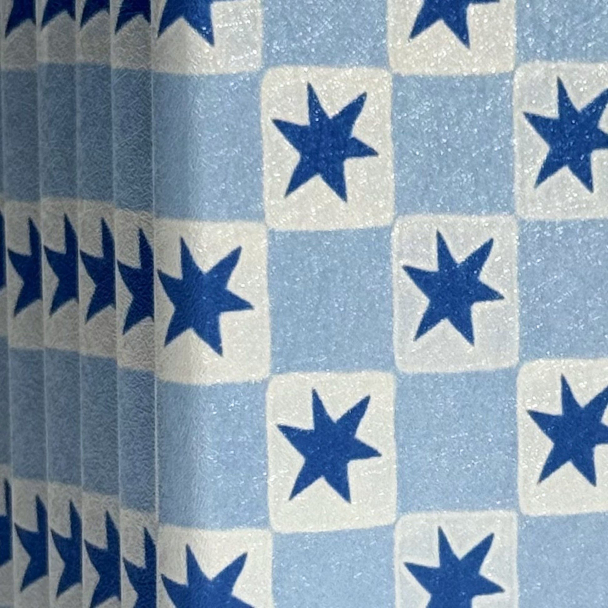 Close-up of the blue star check on a Falling Stars Kobo Clara case, Case Society Co