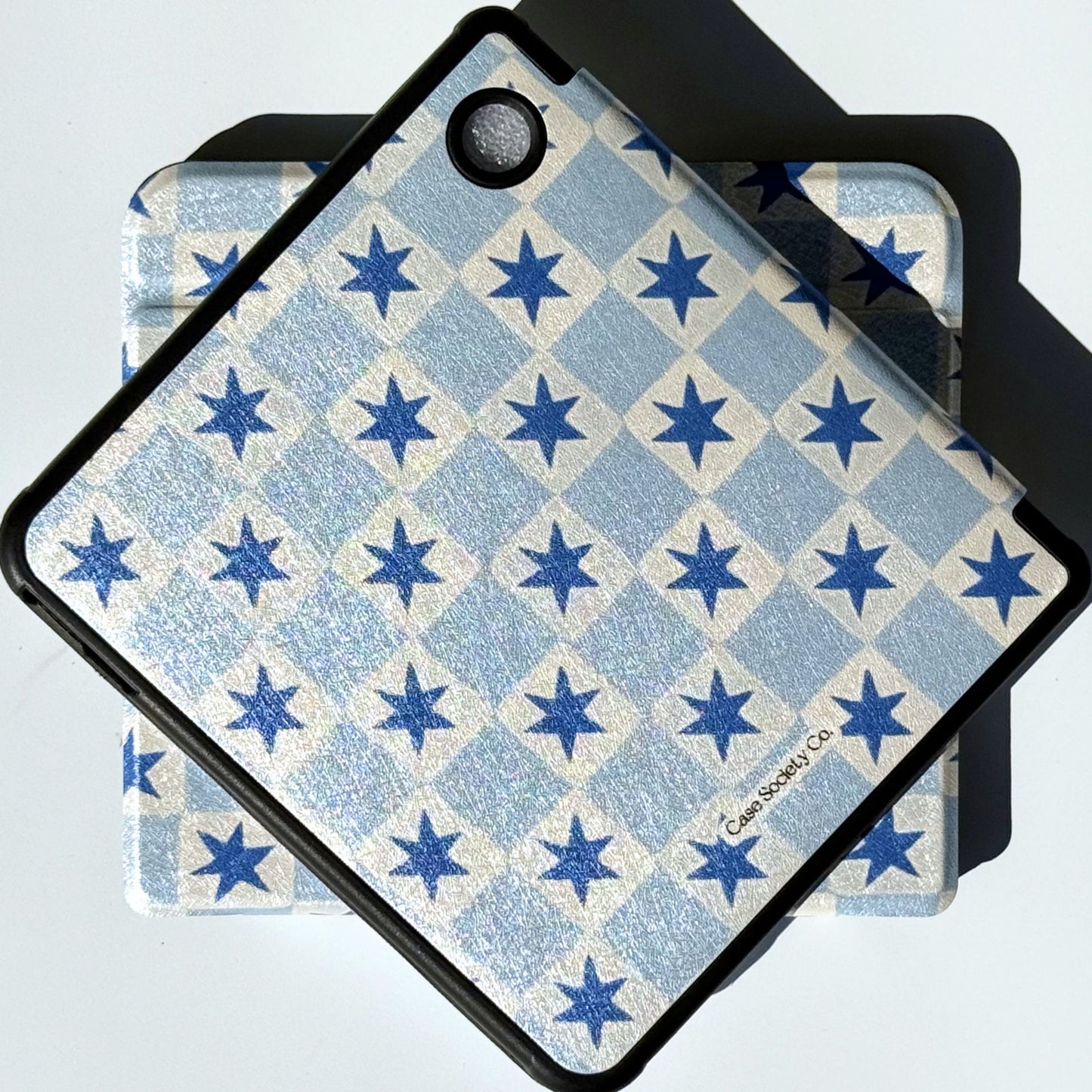 Detail of the navy stars and blue check on a Kobo Libra case, Case Society Co