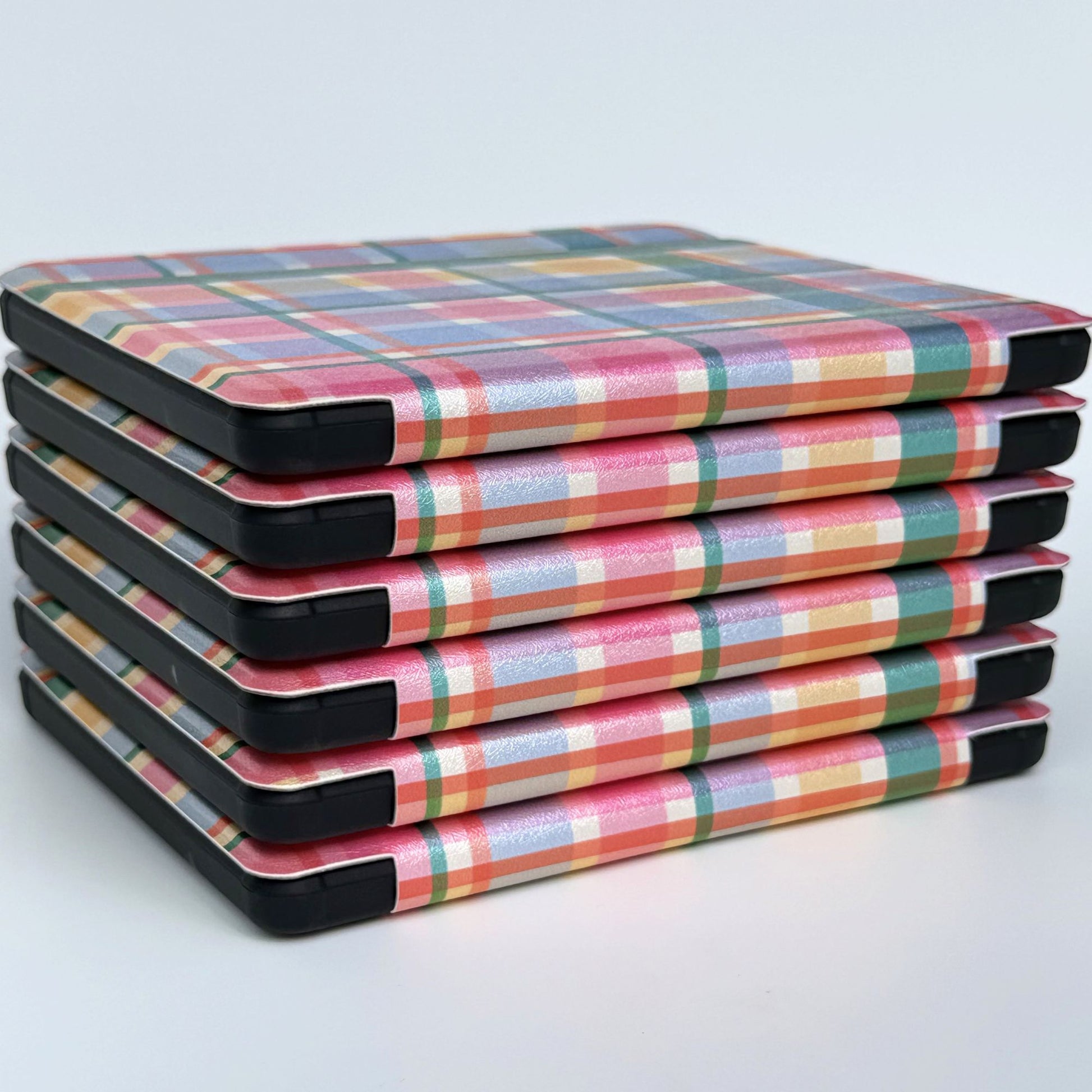 Stack of Storybook Check Kobo cases.