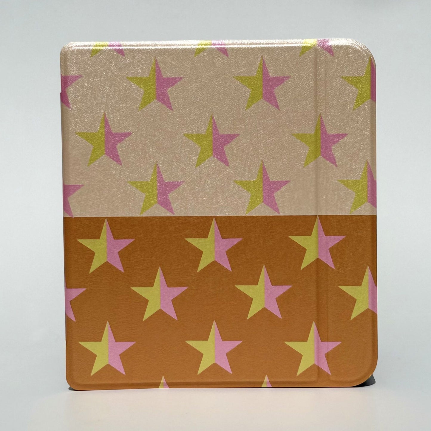 Stack of protective Kobo cases with star print.