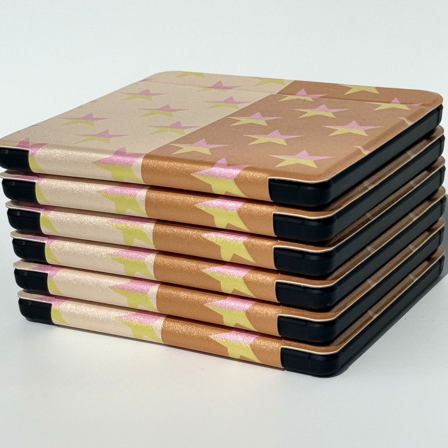 Stack of Stardream Kobo cases with star print.