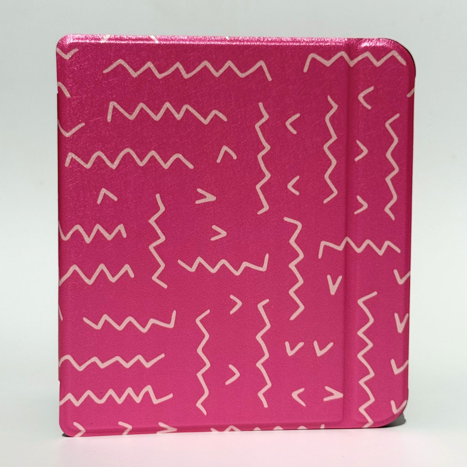 Flat lay of three Literary Lines Kobo Libra cases in hot pink — perfect bookworm gift Australia