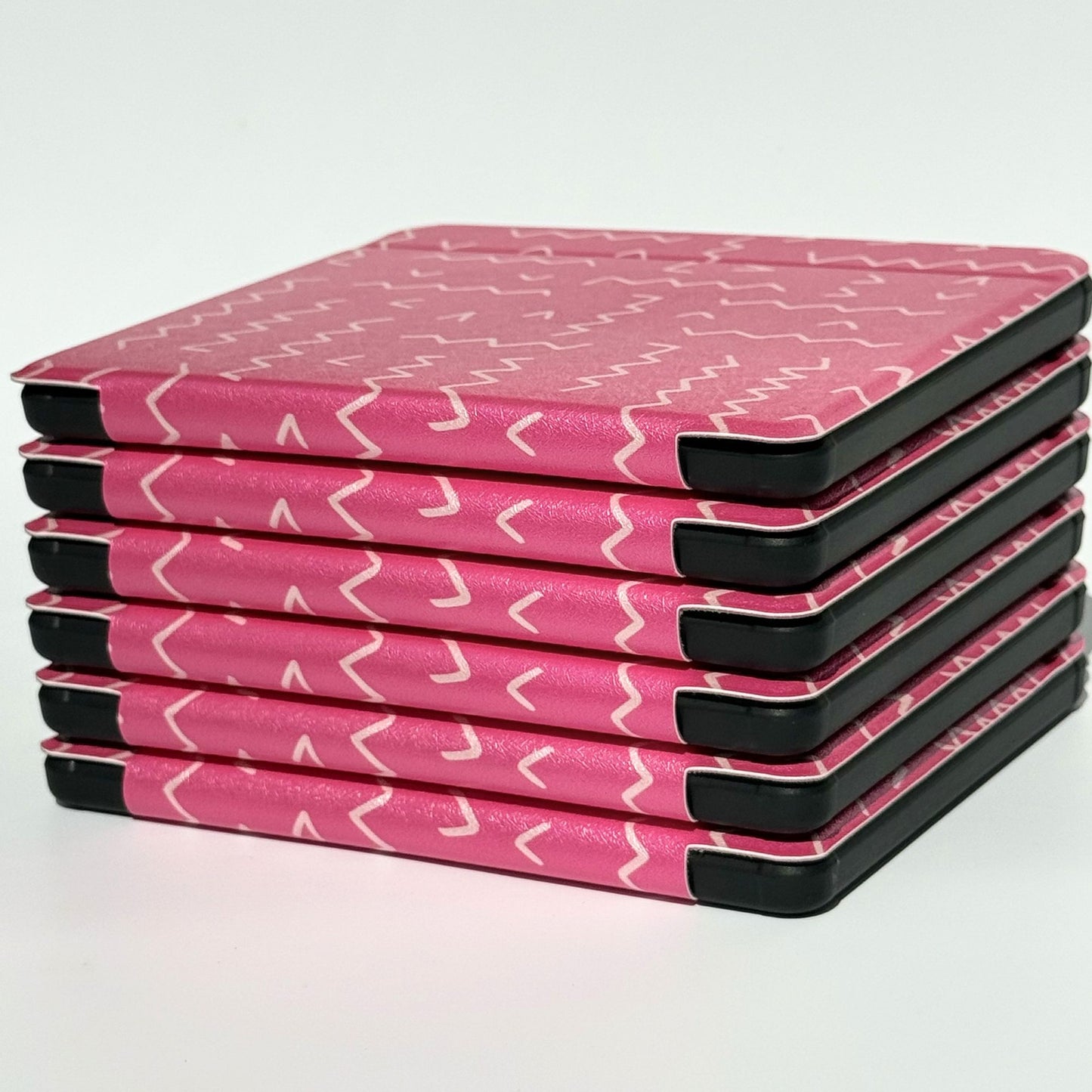 Side view of stacked Literary Lines Kobo Libra cases in pink squiggle aesthetic — Case Society Co. ereader cover