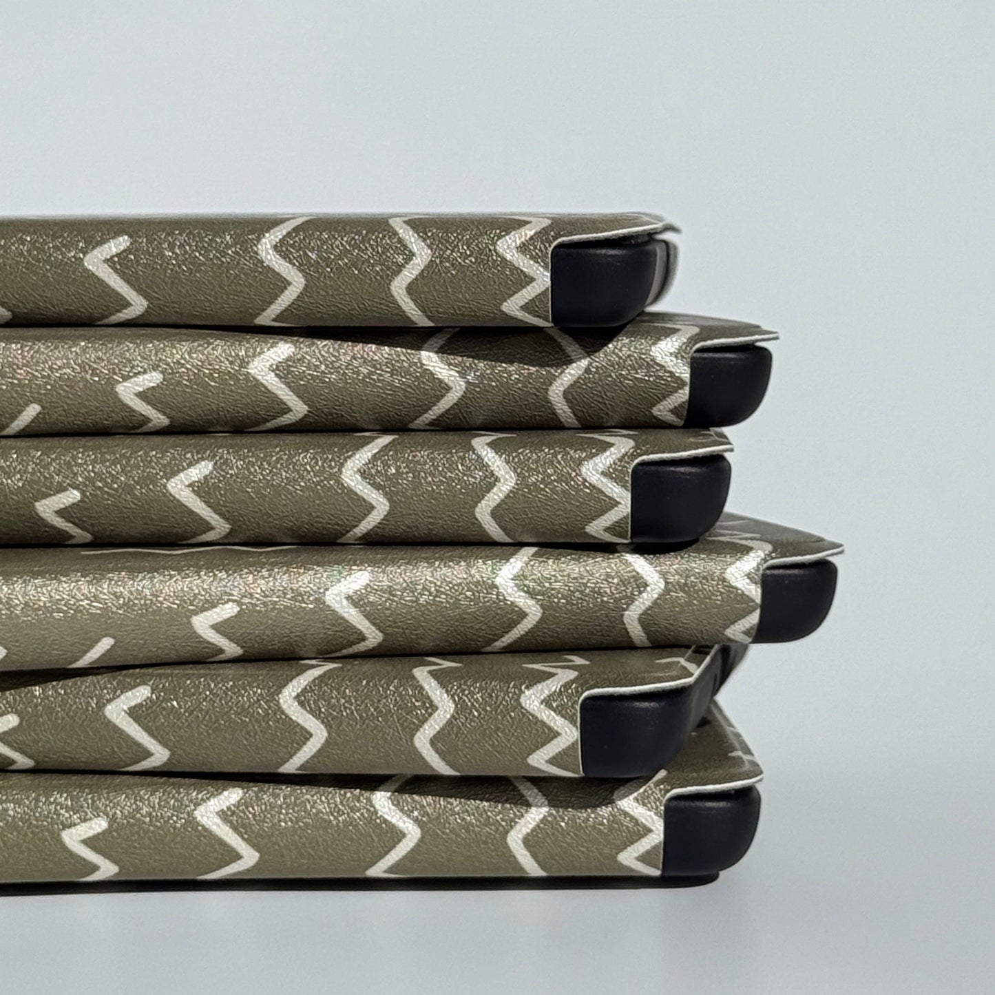 Angled Off Script green zigzag Kindle cases showing the tonal stitch print