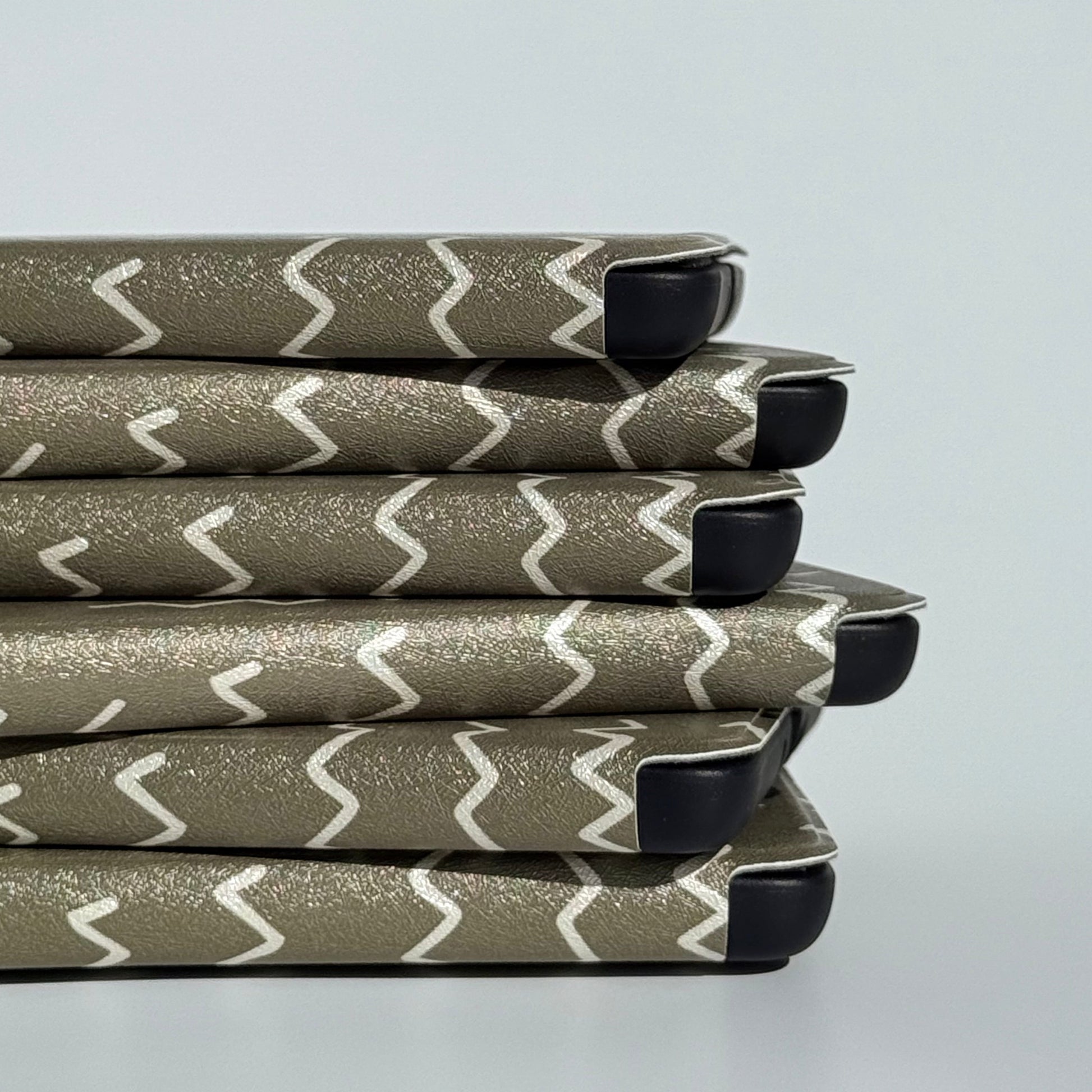 Angled Off Script green zigzag Kindle cases showing the tonal stitch print
