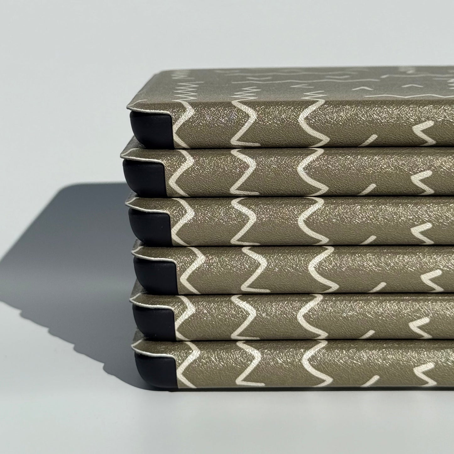 Off Script olive green Kindle case with the cream zigzag stitch, front view