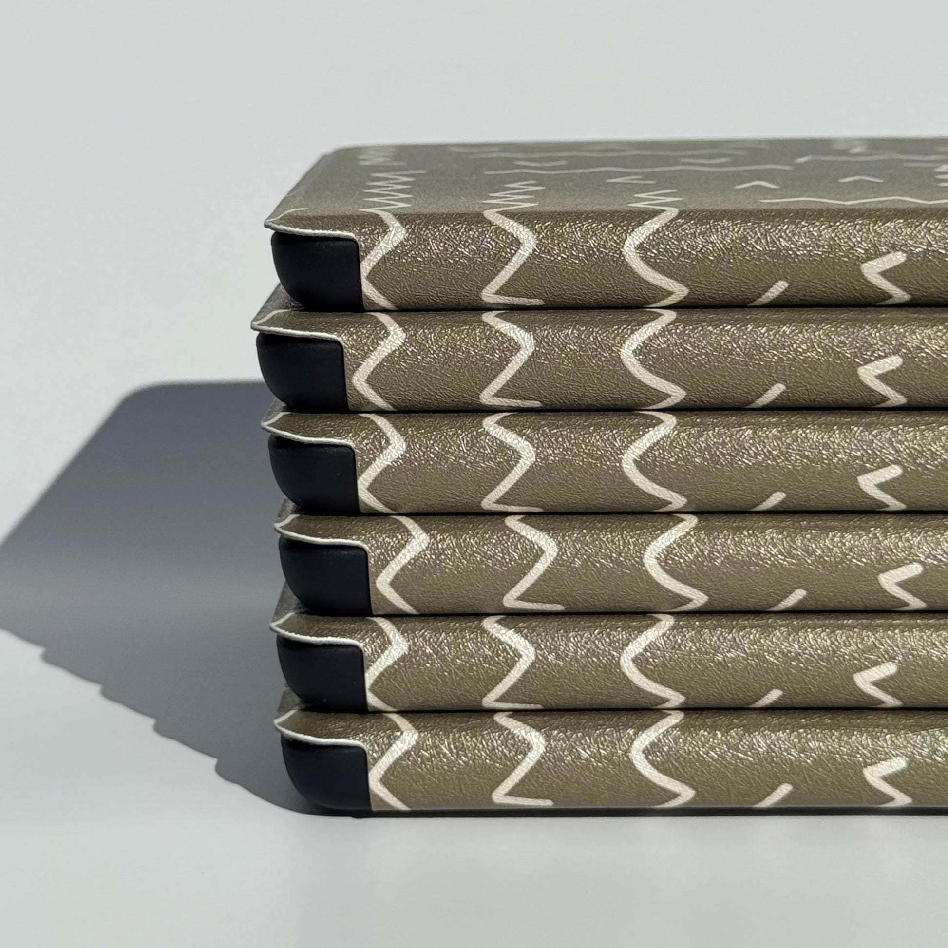 Off Script olive green Kindle case with the cream zigzag stitch, front view