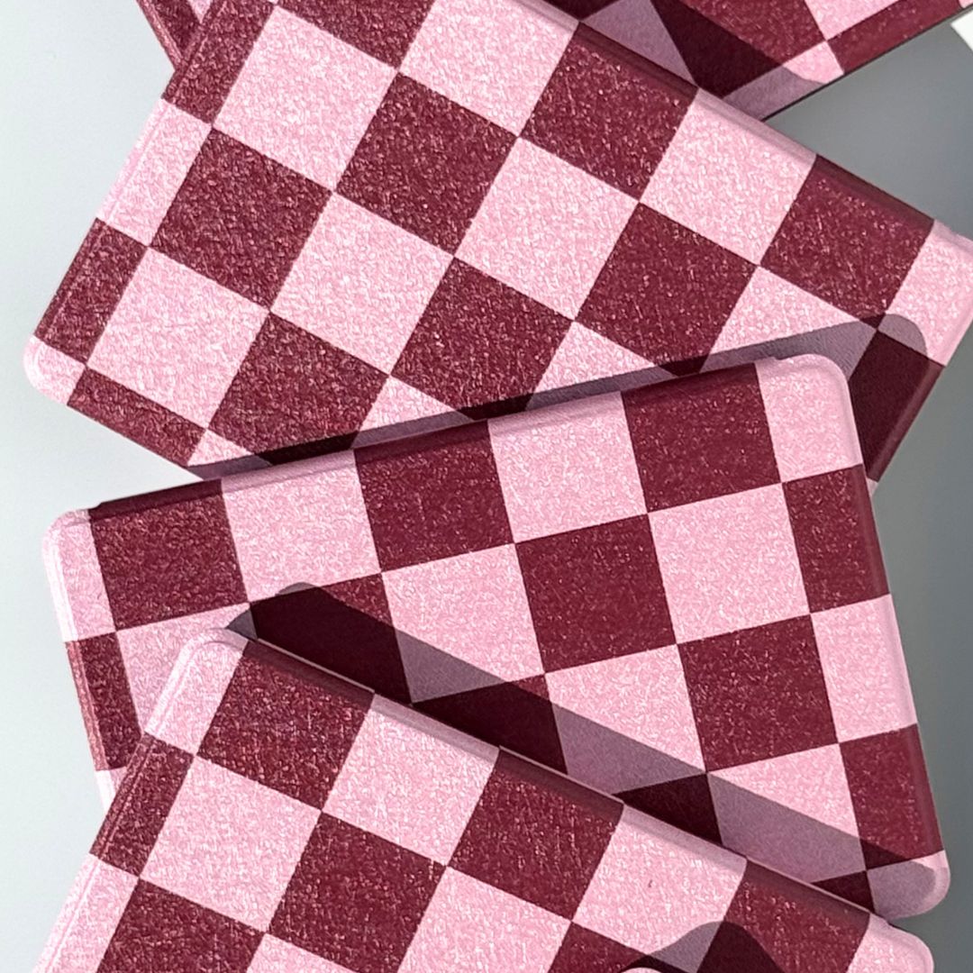 Two pink and burgundy checkered Kindle cases on mint background — aesthetic Bordeaux Fiction Kindle case Australia
