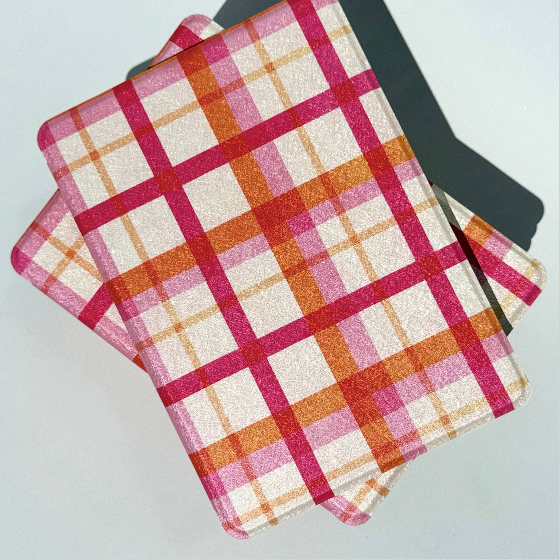 Pink plaid Kindle cases from above, shipped from our Australian shop