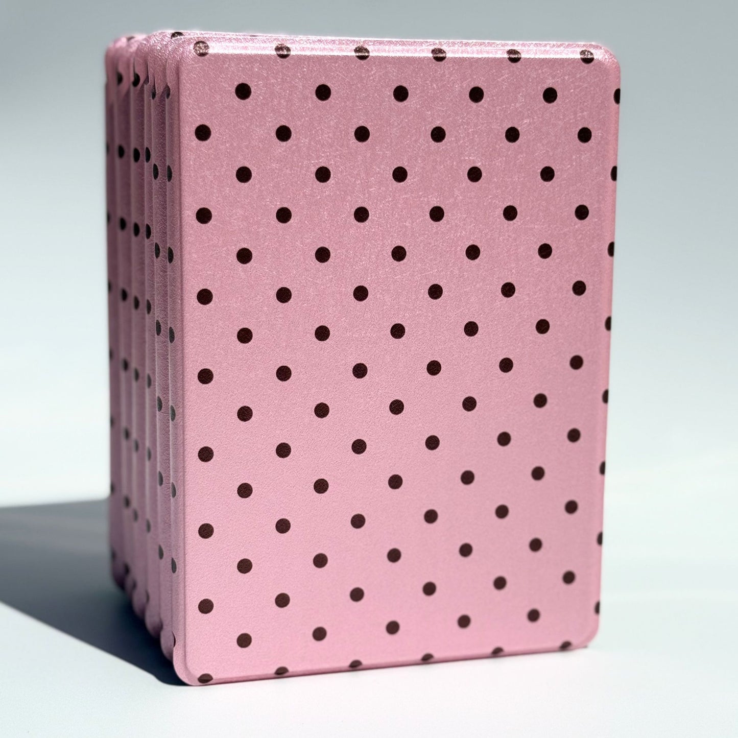 Pink Reverie pink polka dot Kindle case standing upright, aesthetic blush cover from Case Society Australia