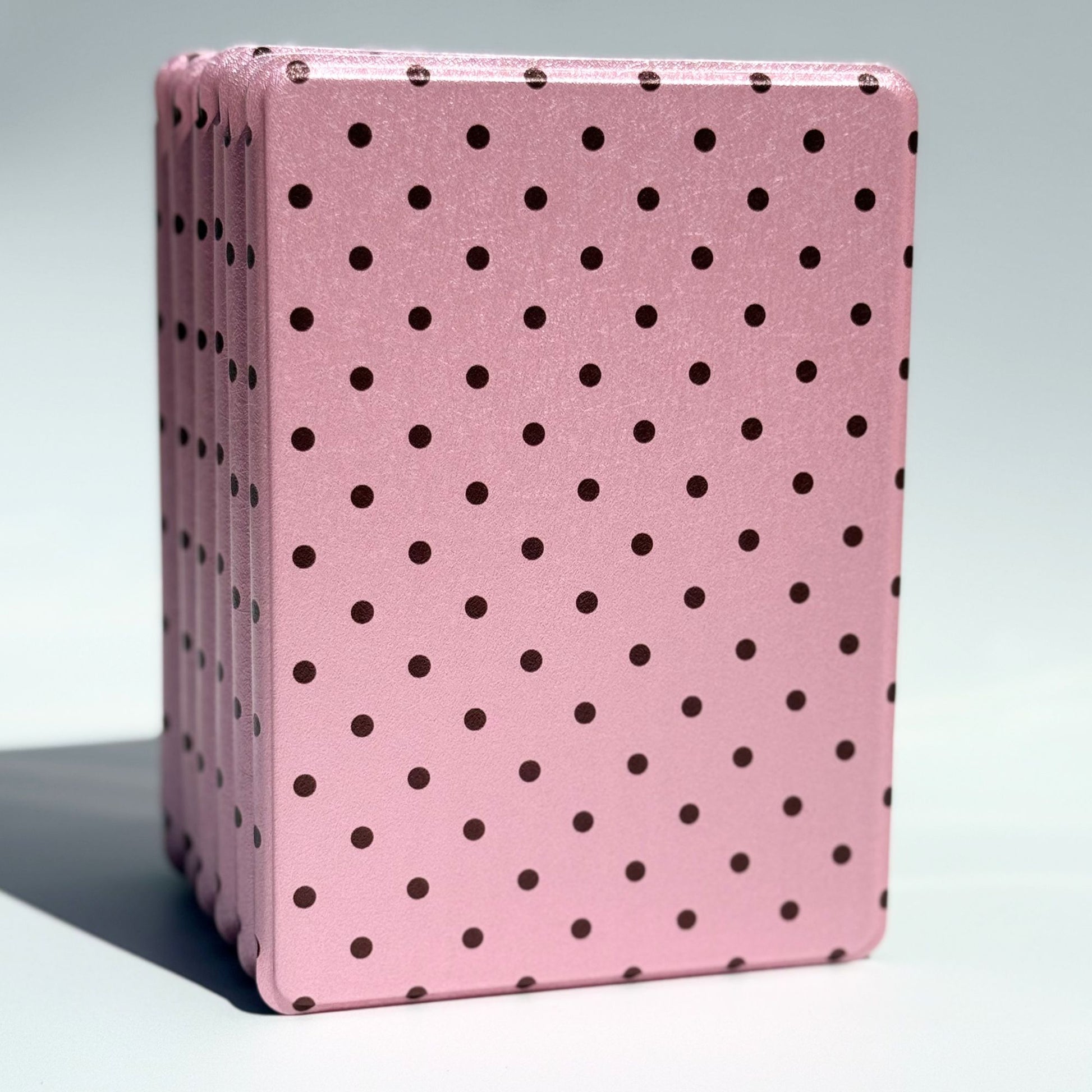Pink Reverie pink polka dot Kindle case standing upright, aesthetic blush cover from Case Society Australia