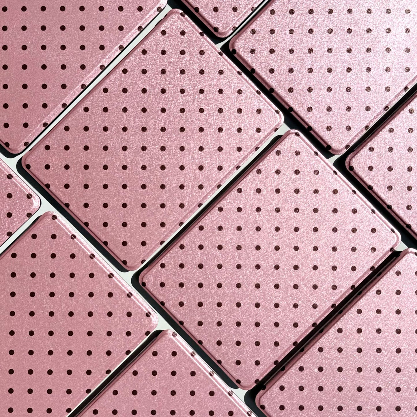 Pink polka dot pattern of Pink Reverie Kindle cases arranged in a tiled grid