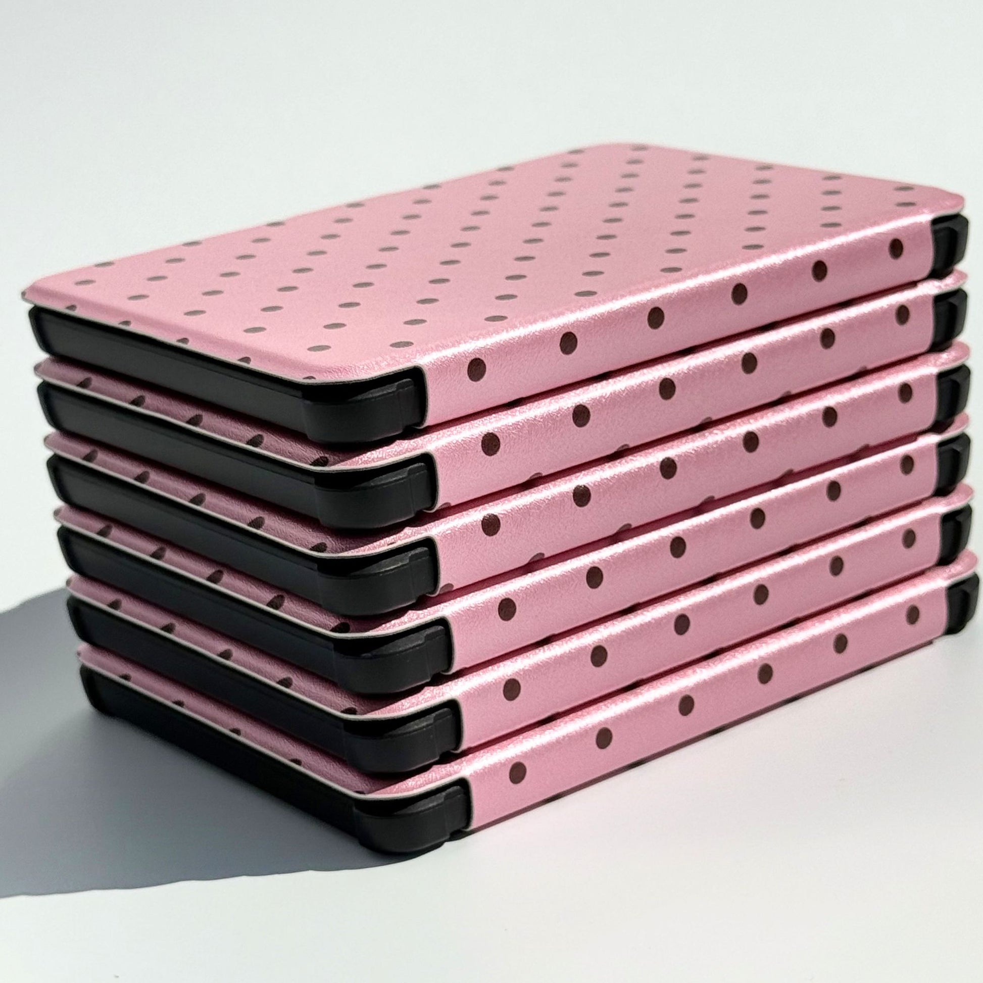 Pink Reverie Kobo Clara cases stacked, angled top view, aesthetic pink polka dot