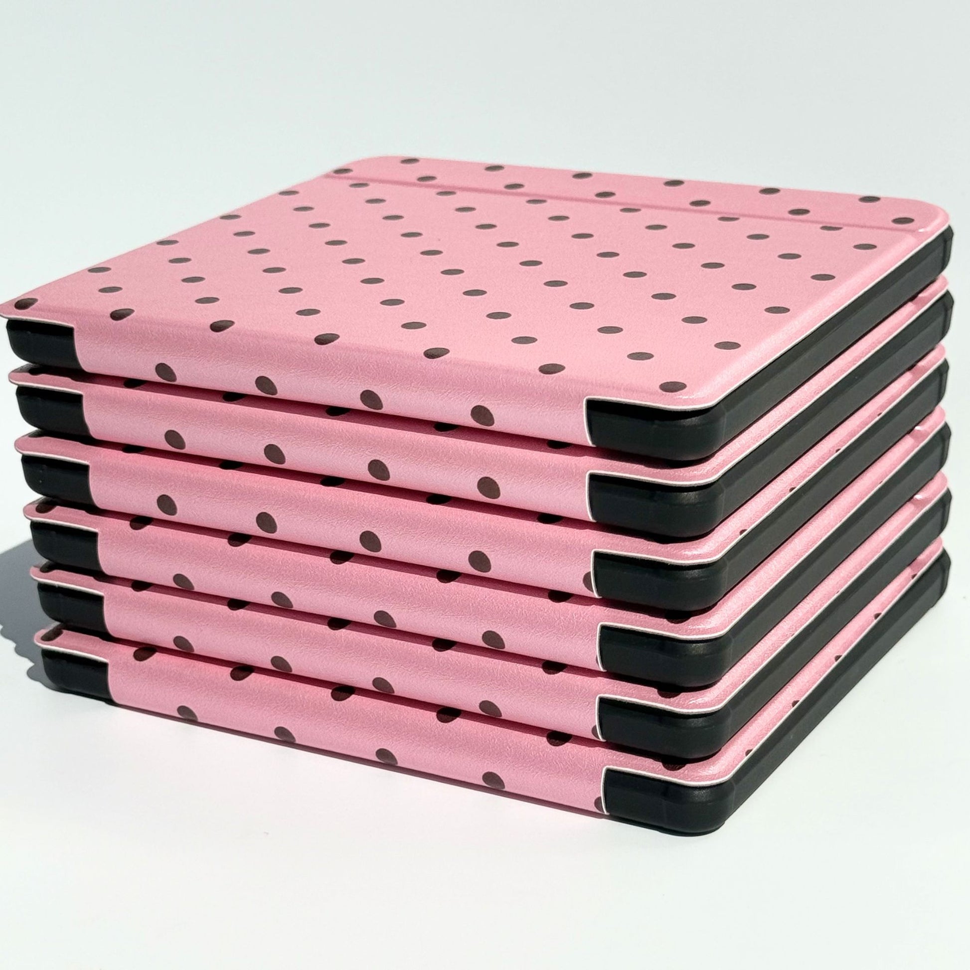 Angled stack of Pink Reverie Kobo Libra cases, pink polka dot covers