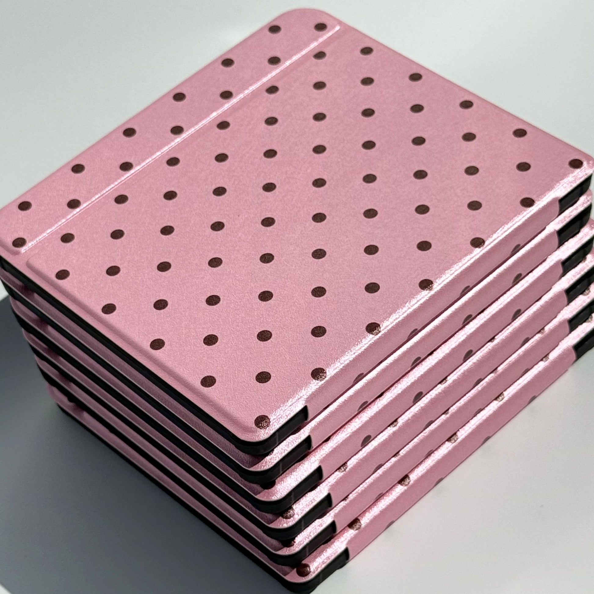 Stack of Pink Reverie Kobo Libra cases, pink polka dot folio covers