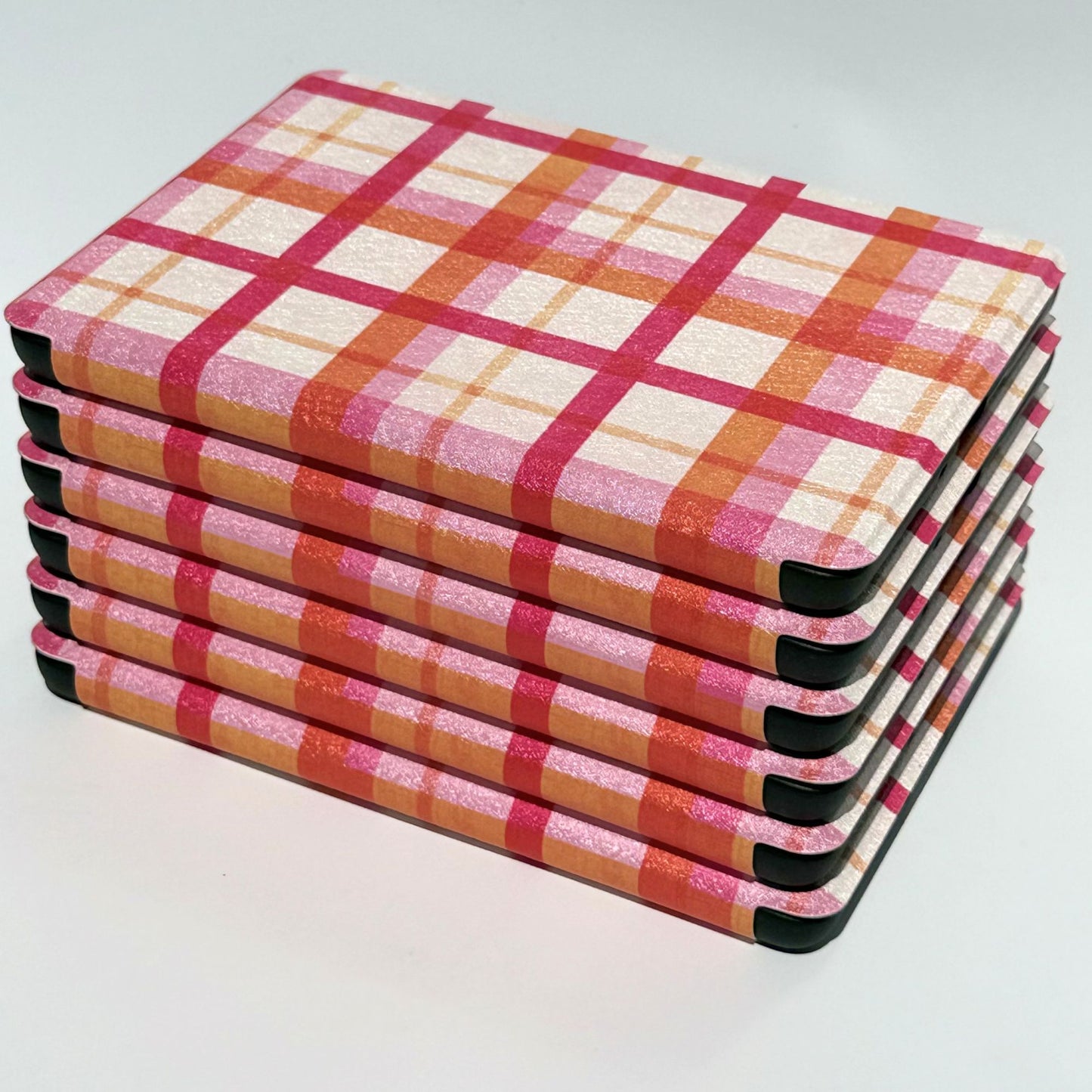 Pink, orange and red tartan check Kindle cases stacked, Case Society Co