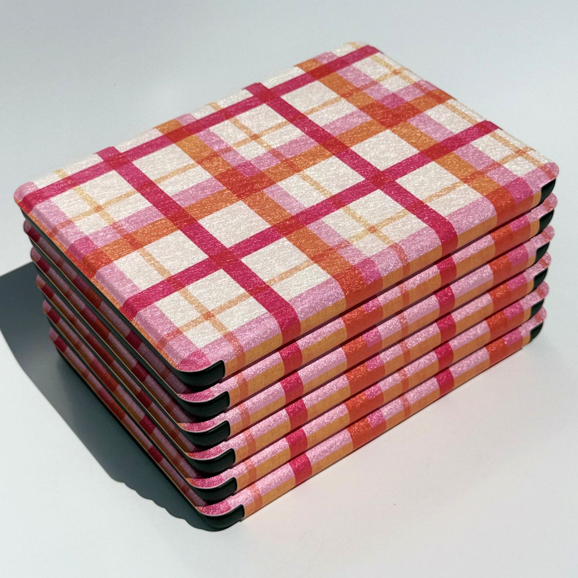 Pink and orange plaid Kindle case in the Roseline design, front view