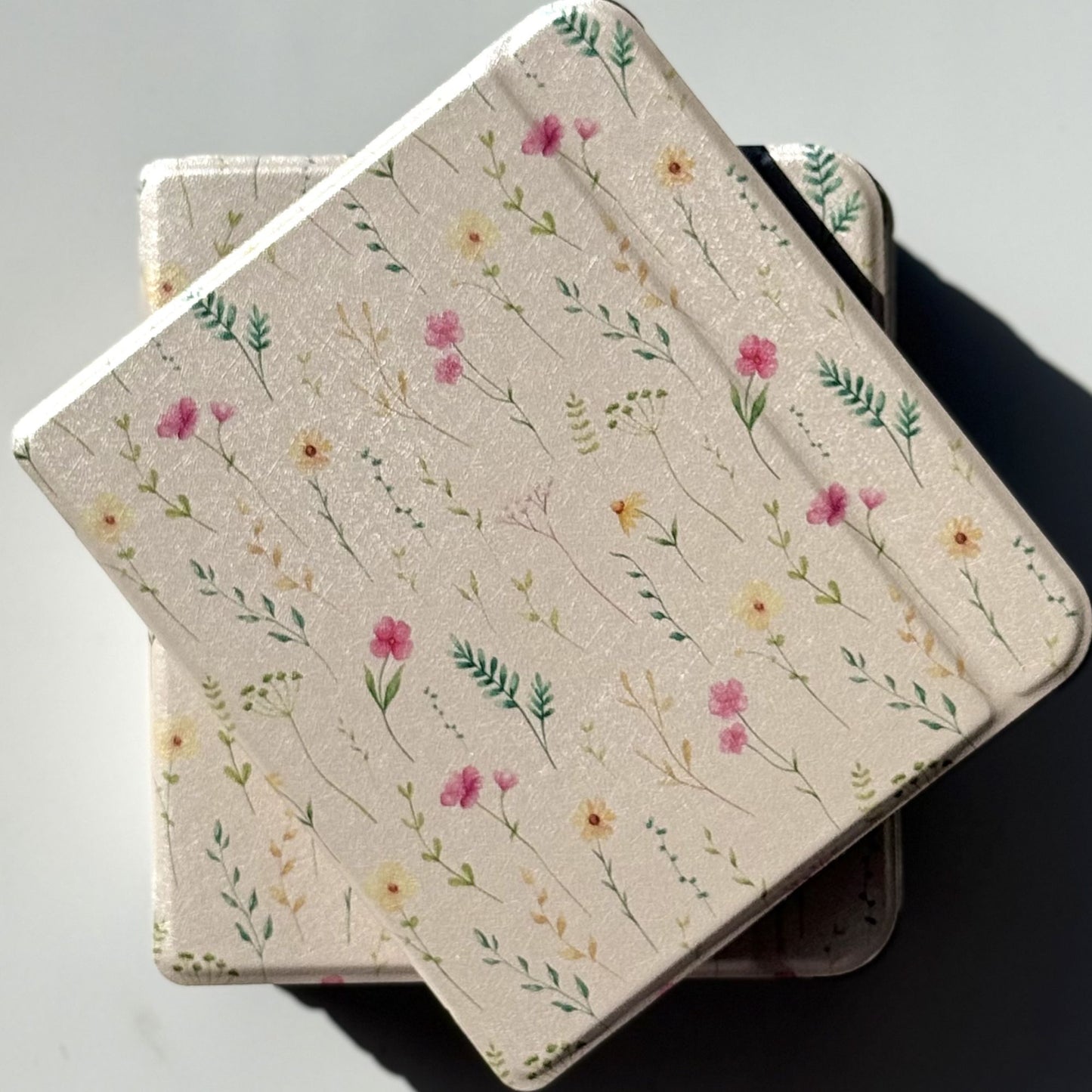 Overlapping Spring Court Kobo Libra cases — cream romantasy floral ereader cover inspired by the Spring Court of ACOTAR