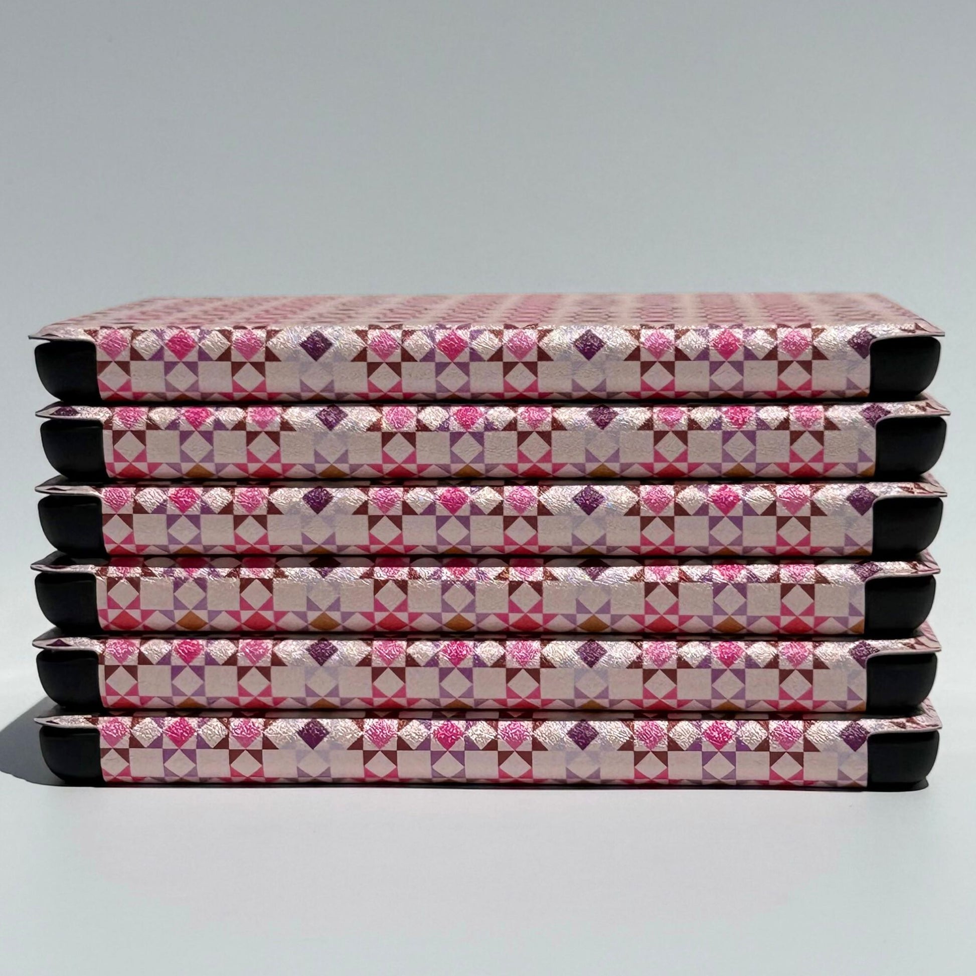 Pink Kindle case with textured fabric inspired woven print