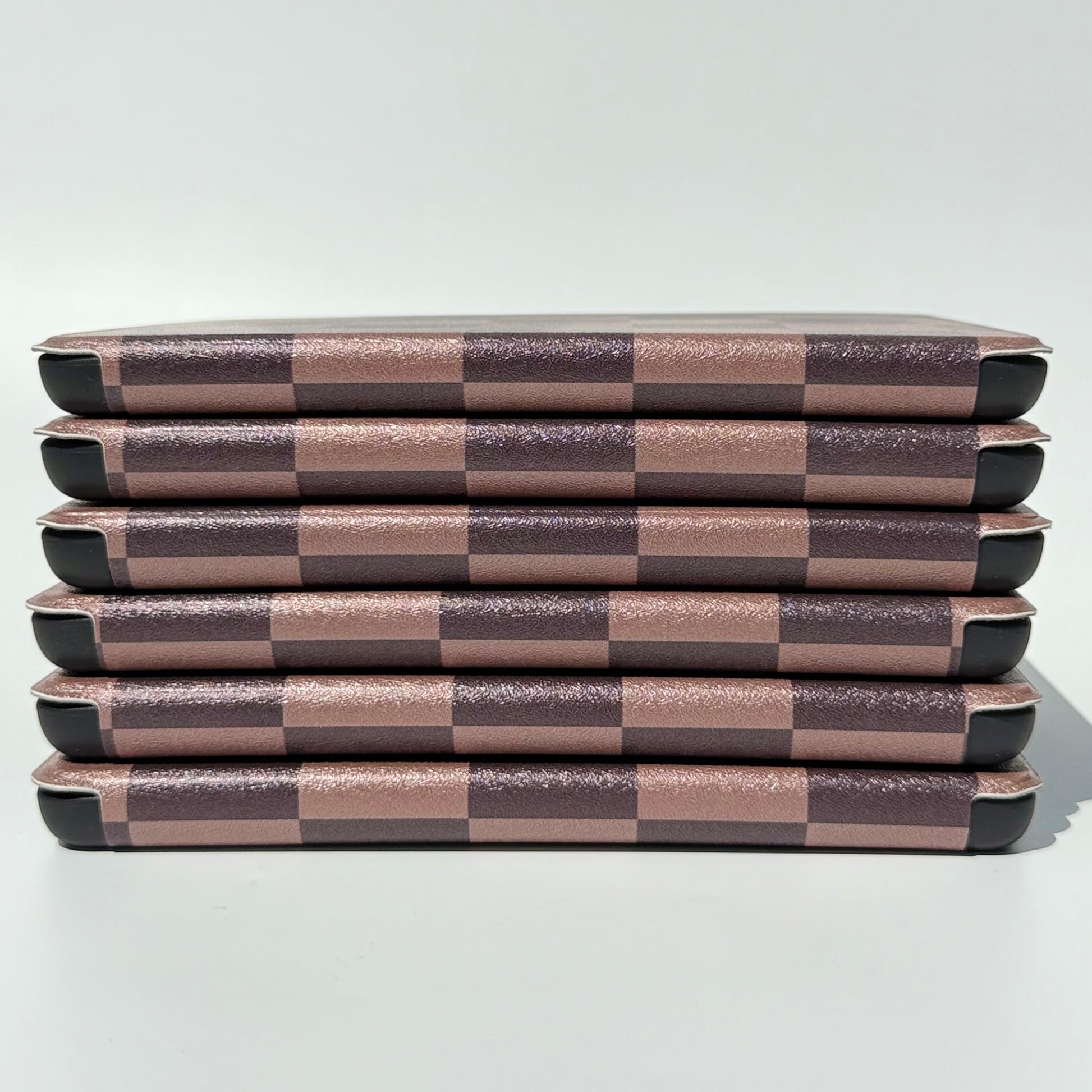 The Dreamer kindle case side view of stack of cases check print