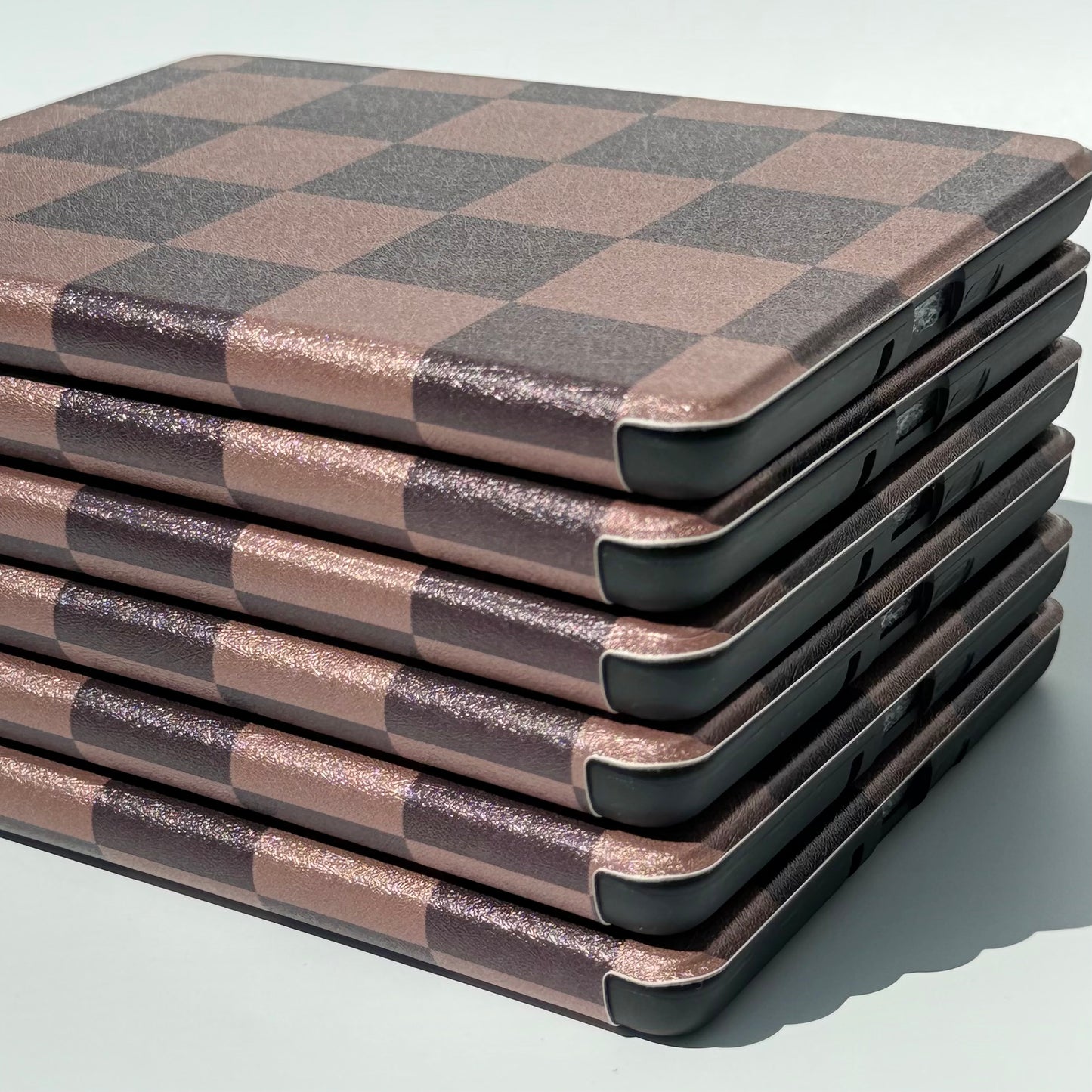 The Dreamer kindle case side view of a stack of kindle cases showing slim design