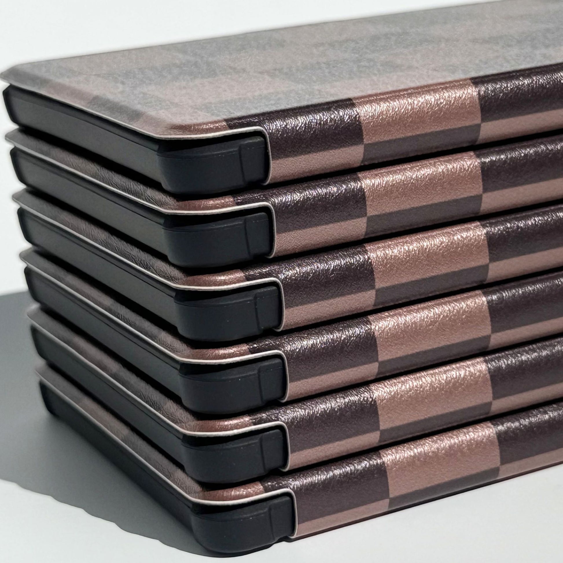 Close-up of The Dreamer Kobo Libra case showing mocha checker pattern detail and aesthetic dark academia print