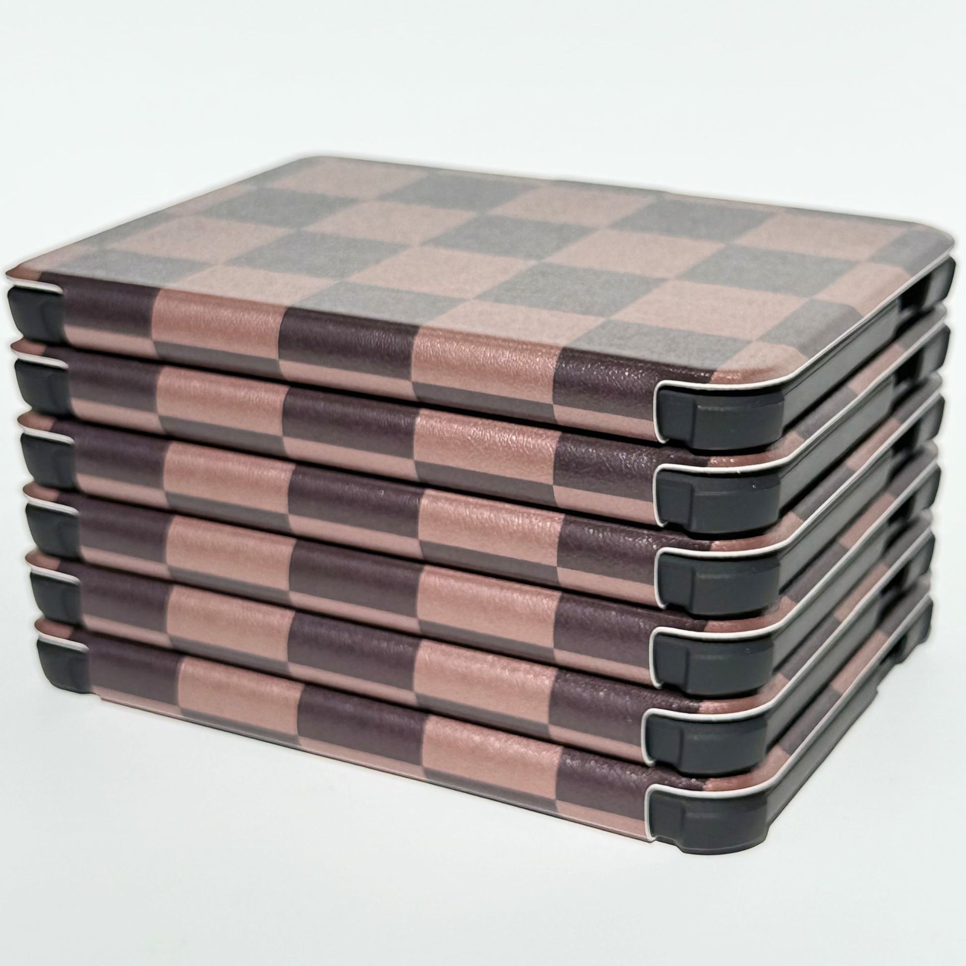 Top angle view of The Dreamer Kobo Libra cases stacked, brown checkered bookish design from Case Society Co.