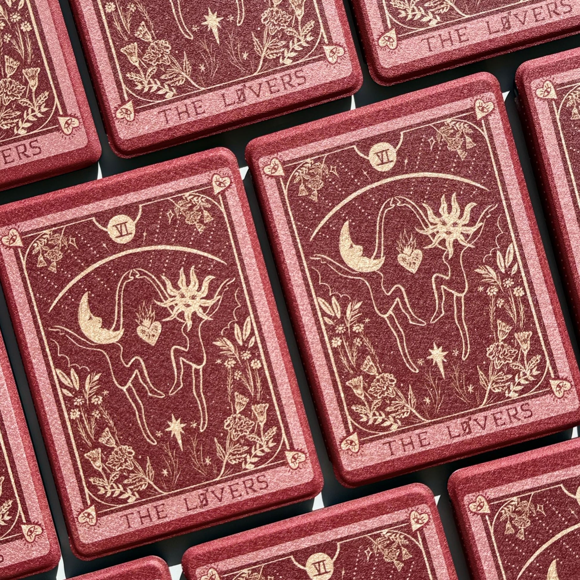 flatlay of The Lovers Kindle paperwhite cases showing the full tarot pattern repeat — Case Society Australia