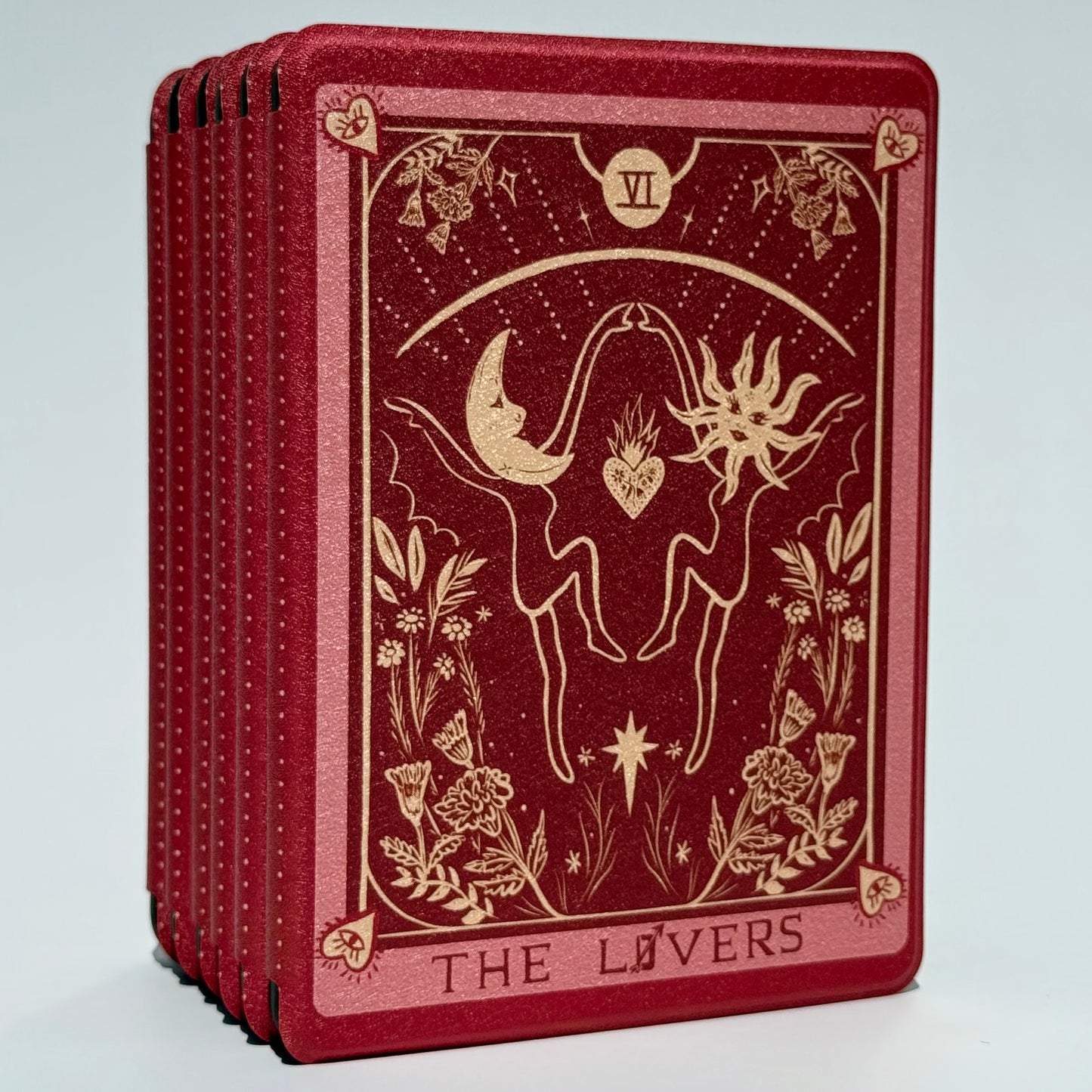 Front of The Lovers Kindle case showing the gold tarot illustration and THE LOVERS lettering on wine red