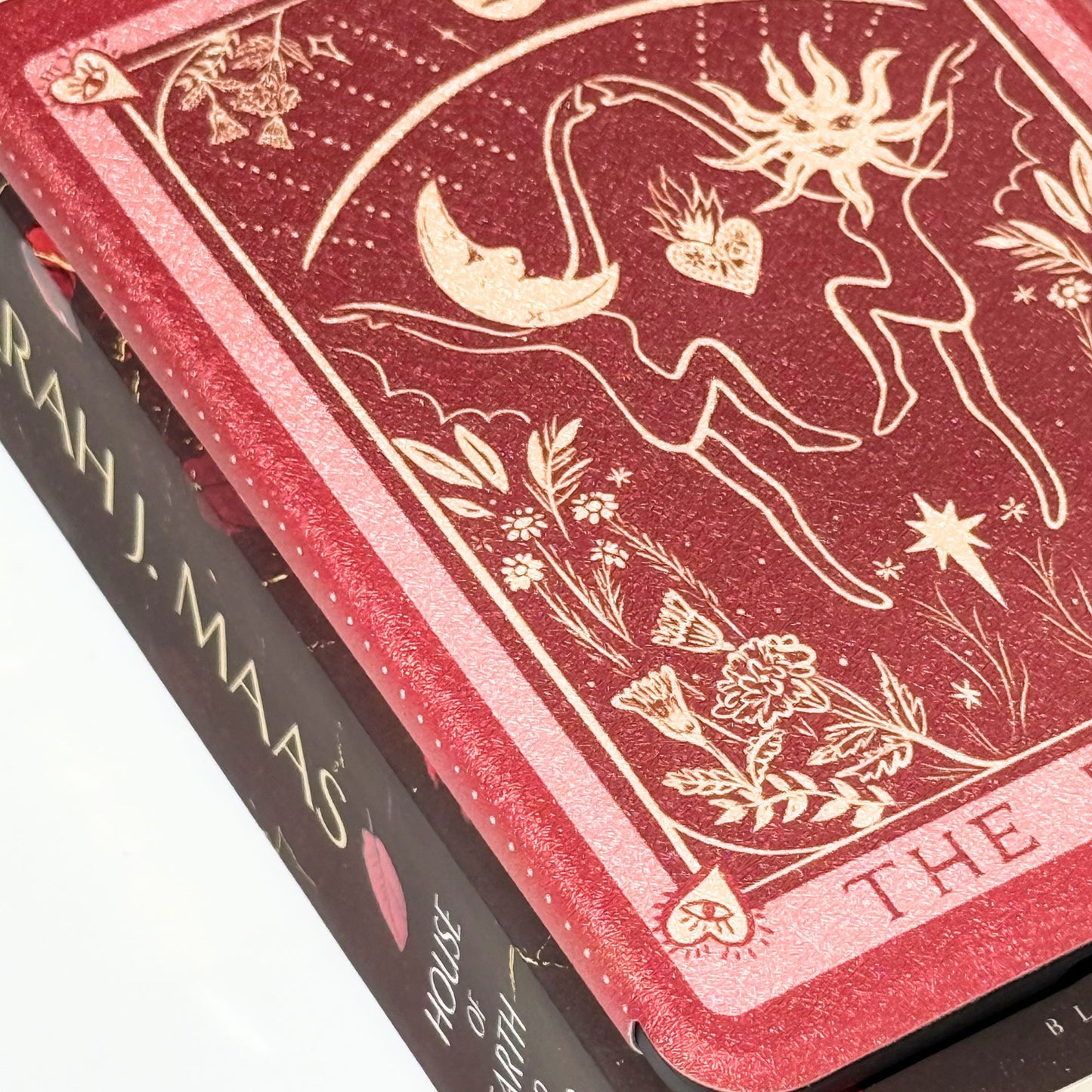 The Lovers Kindle case styled beside a Sarah J. Maas book, a romantasy tarot case for booklovers