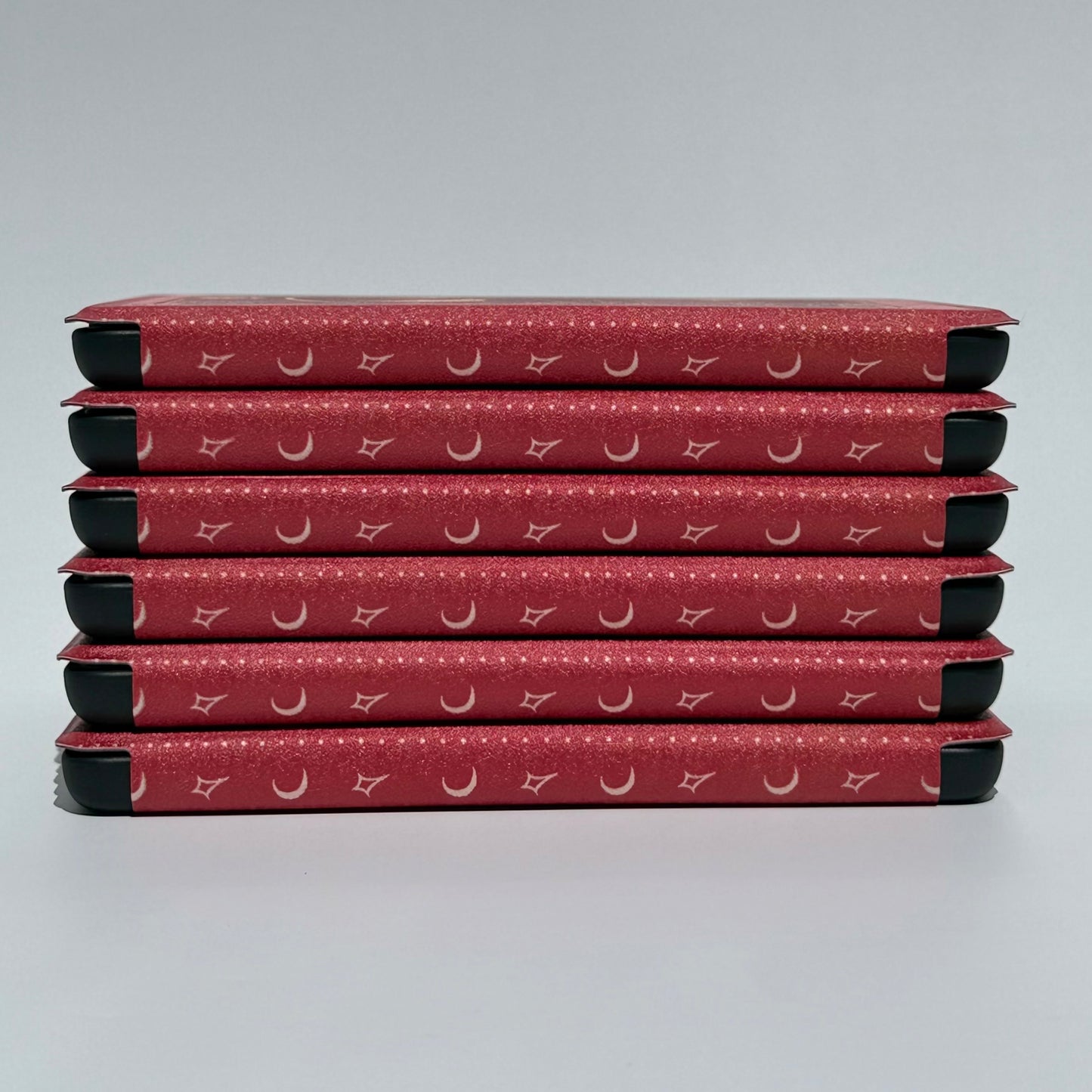 Stack of The Lovers Kindle cases at an angle showing reinforced protective corners — aesthetic Kindle case AU