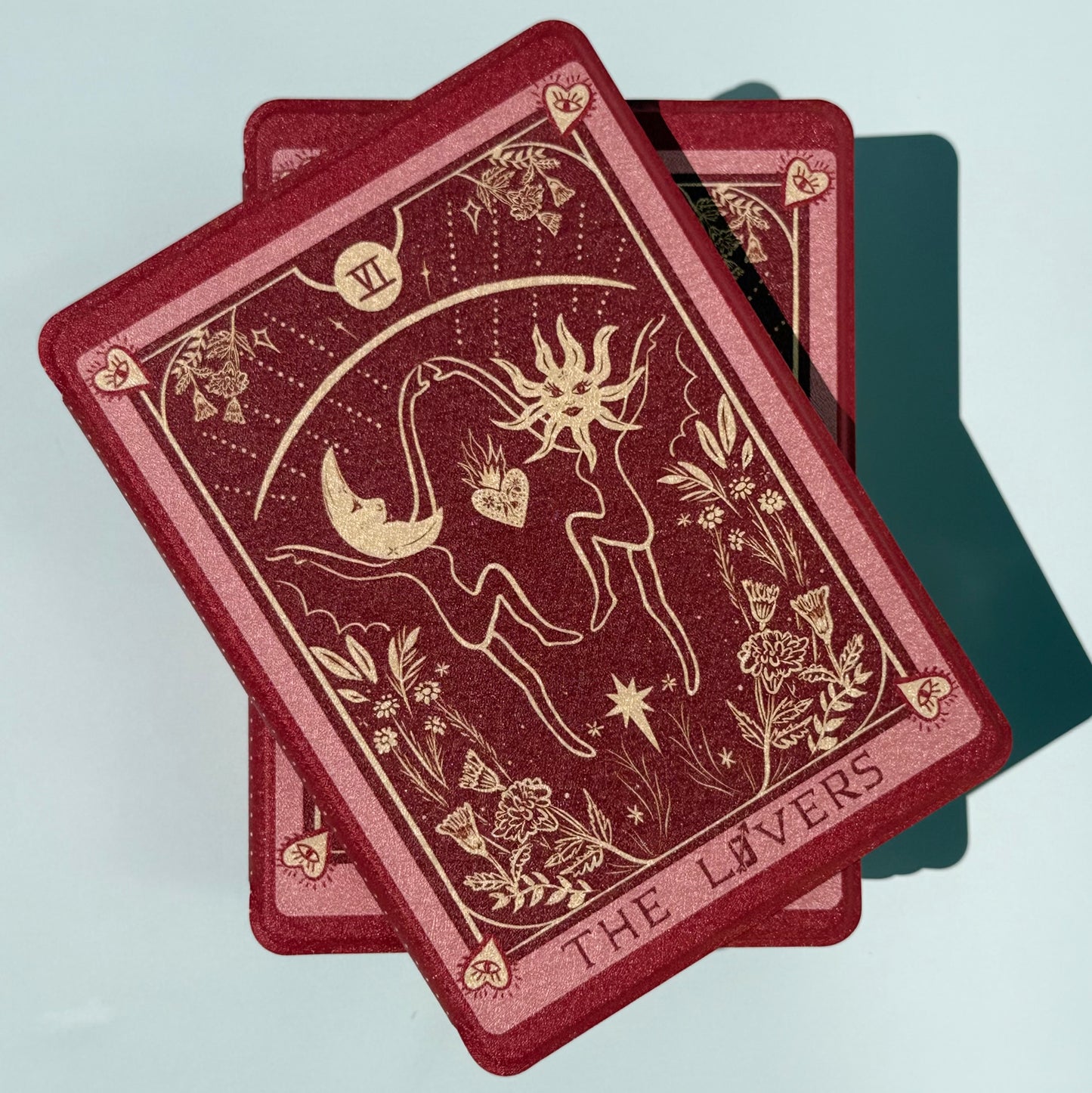 Close front view of the wine red The Lovers tarot Kindle case with antique gold romantasy detail