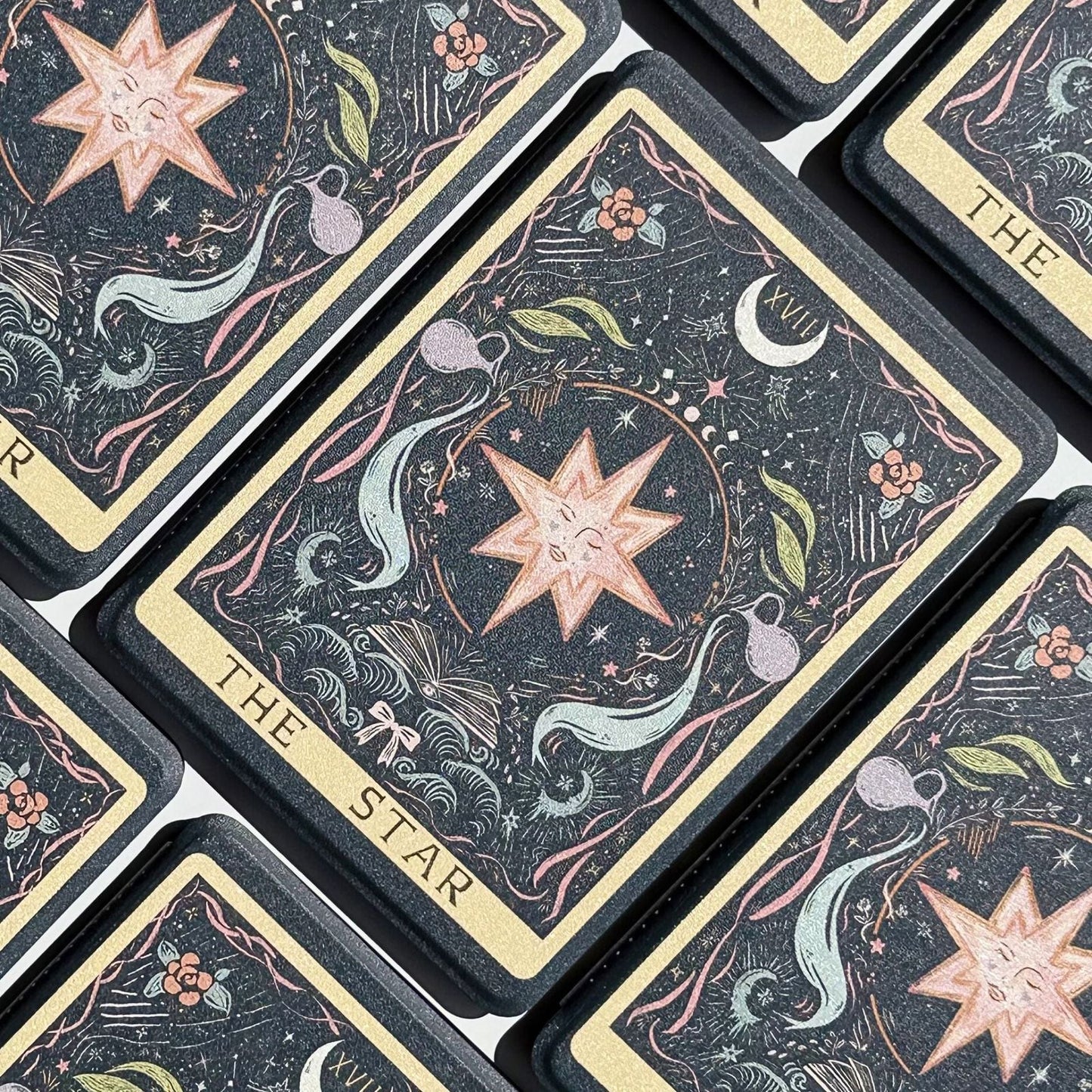 The Star tarot Kindle case flatlay, a dreaming star ringed by moon phases and water jugs, from Case Society