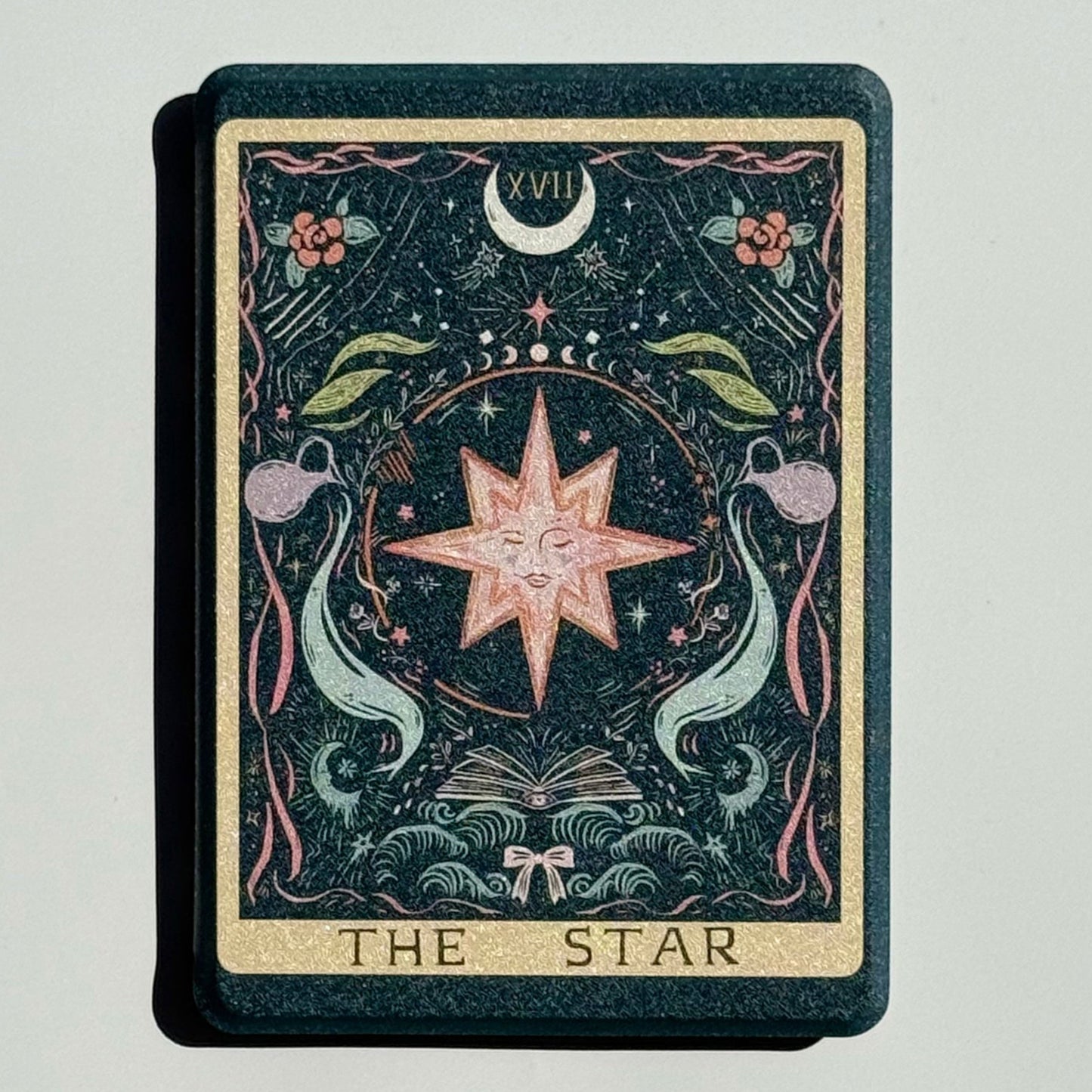 The Star Kindle case flat in the sun, the full tarot card from gold border to THE STAR title