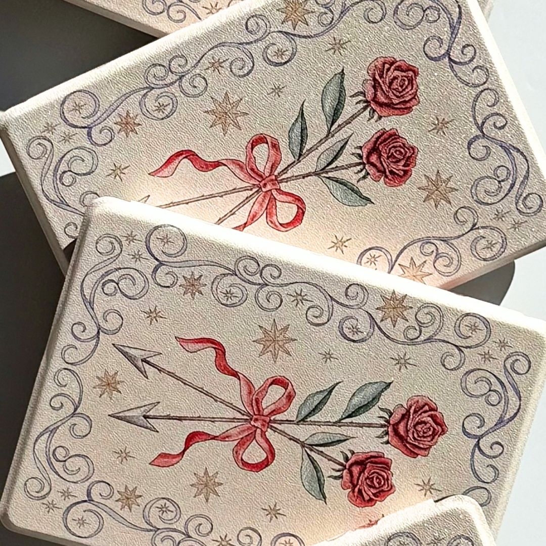 Rose and arrow Kindle cases overlapped in soft light, Case Society Co Australia