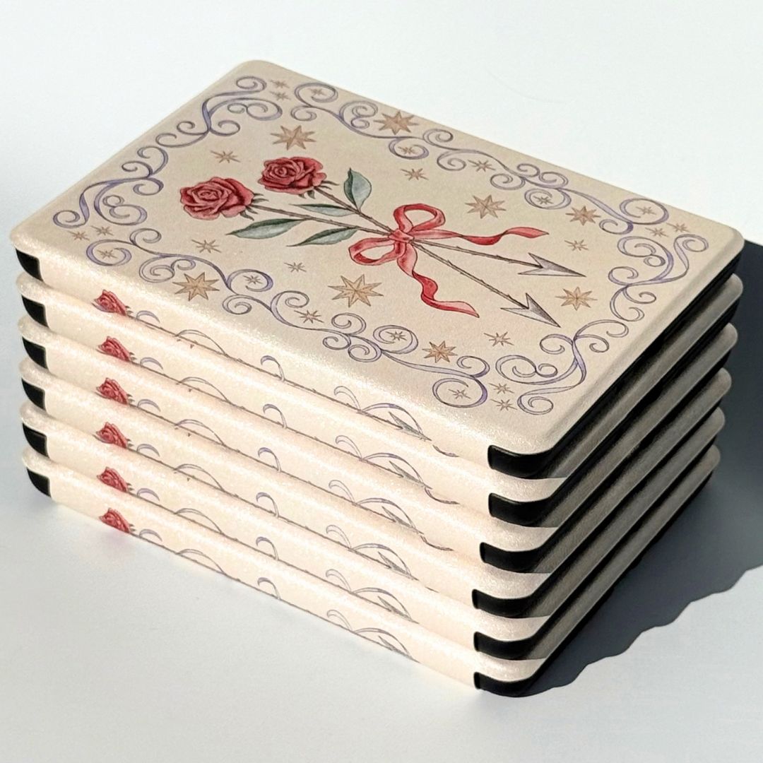 Stack of cream rose Kindle cases with a rose on every spine, Kindle case Australia