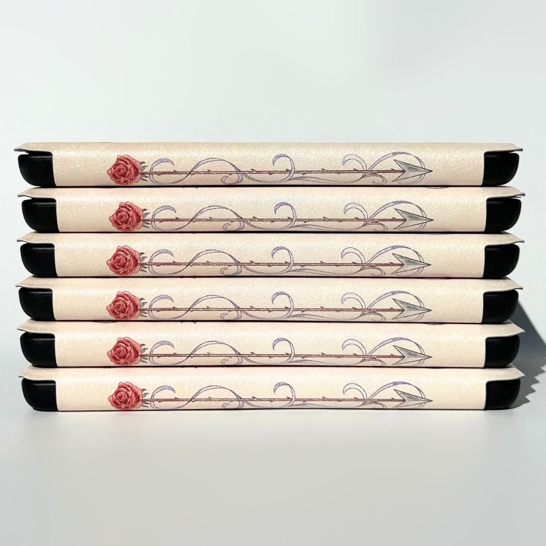 Six rose Kindle cases stacked, each spine a rose-tipped arrow, Kindle case Australia