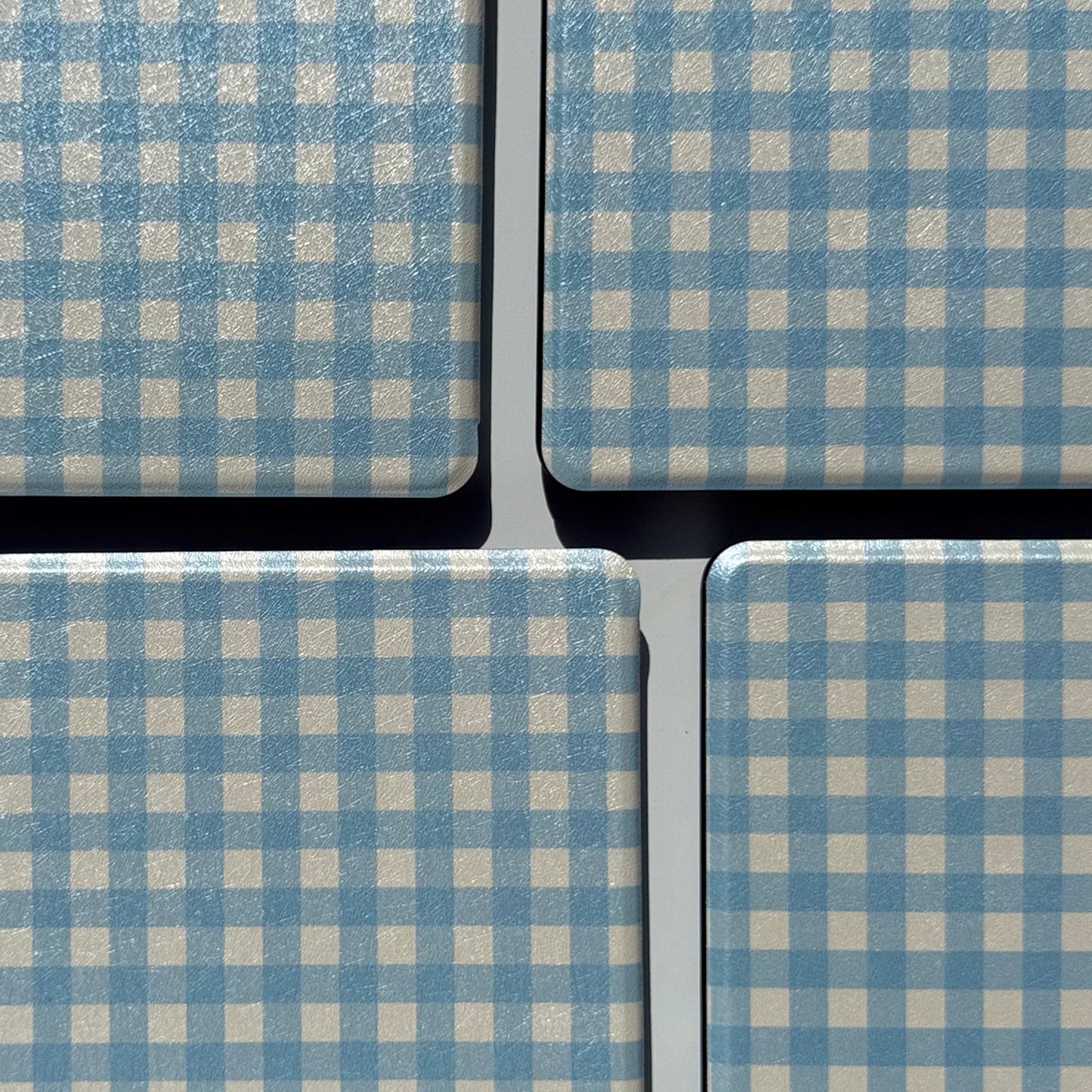 Close-up of blue and cream gingham pattern on The Quiet Blue Kindle case, coastal aesthetic