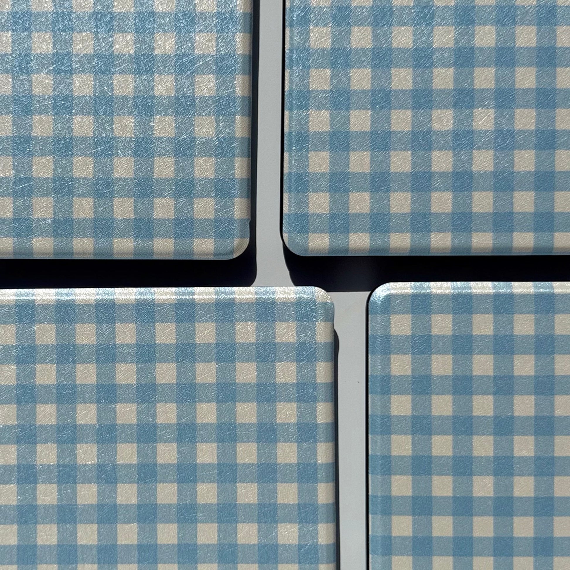 Close-up of blue and cream gingham pattern on The Quiet Blue Kindle case, coastal aesthetic