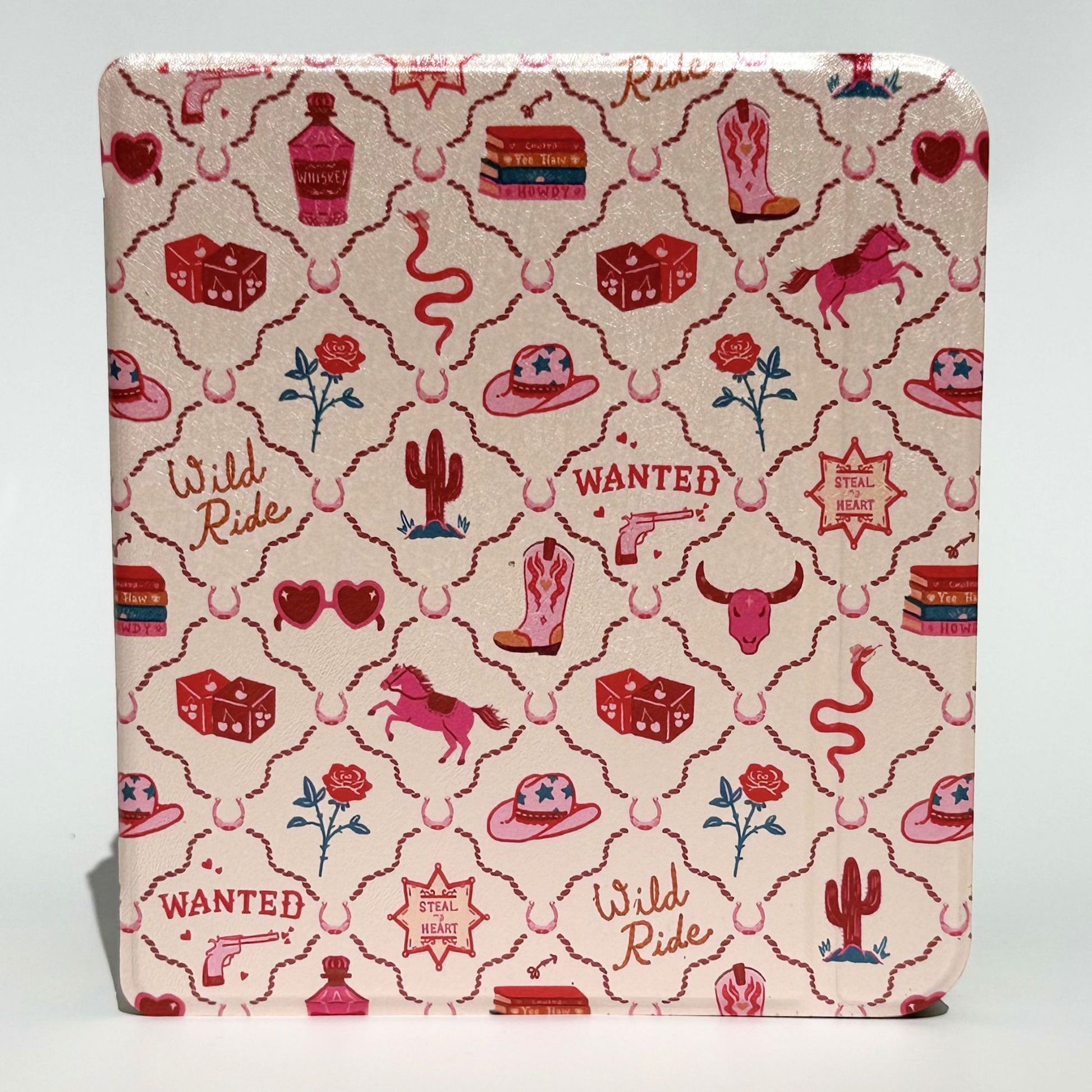 Angled stack of Wild Ride Kobo Libra cases showing pink cowboy print with hats, boots, horses, cacti, roses and dice — Case Society Co.
