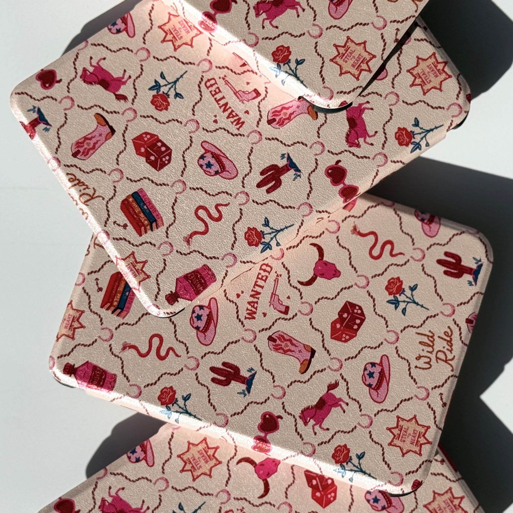 Stacked Wild Ride Kobo Case cases front-facing, pink yeehaw aesthetic print with horseshoes, sheriff stars, cowboy boots and roses